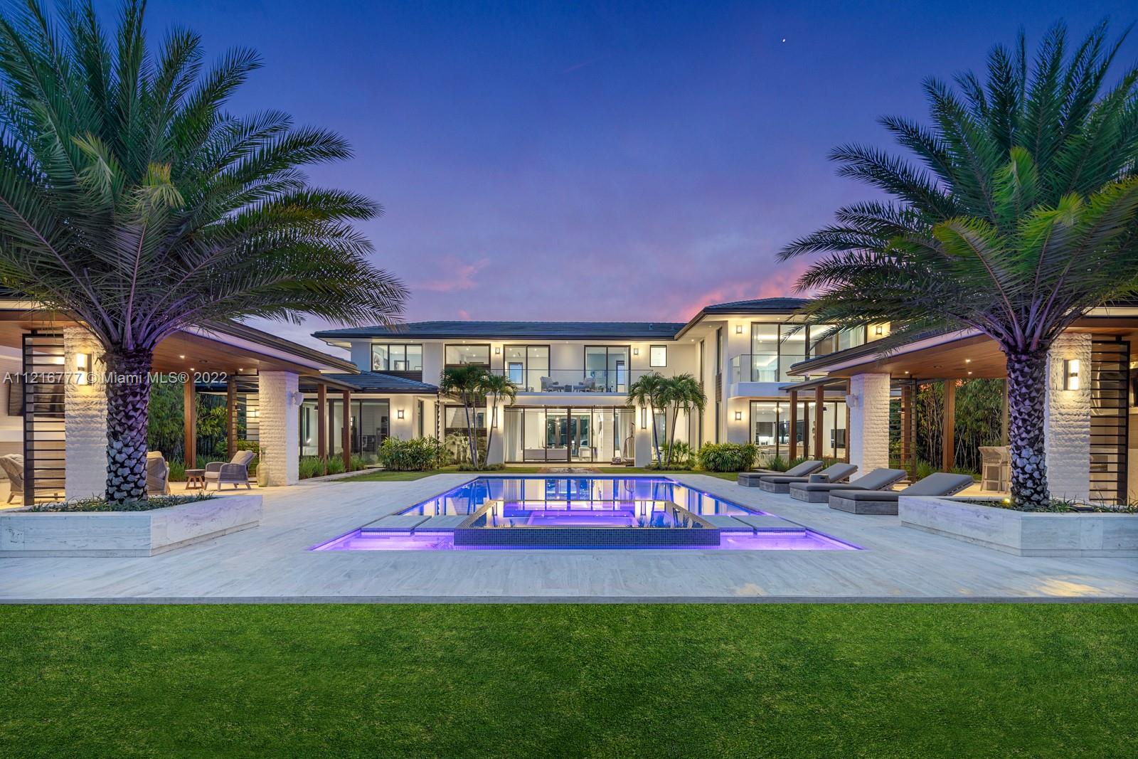 Spectacular gated estate set on over an acre of lushly landscaped grounds. Elegant, modern-style home completed in 2018 w/the finest fixtures & finishes throughout including porcelain tile flooring & floating staircase w/glass railings. Stunning, light-filled living spaces have volume ceilings and walls of glass overlooking the magnificent pool & garden. European-style kitchen features Wolf appliances, Sub-zero wine storage & walk-in pantry. Luxurious master suite (1500 SF) offers a private balcony, room-sized walk-in closet (w/dressing area & vanity) and spa-like his & hers bathrooms. Smart-Home system controls: alarm/cameras, lighting, sound, AC & security gate. Expansive, resort-like outdoor spaces feature 2 gazebos (1 w/full summer kitchen, 1 for lounging) and a fabulous pool & spa.