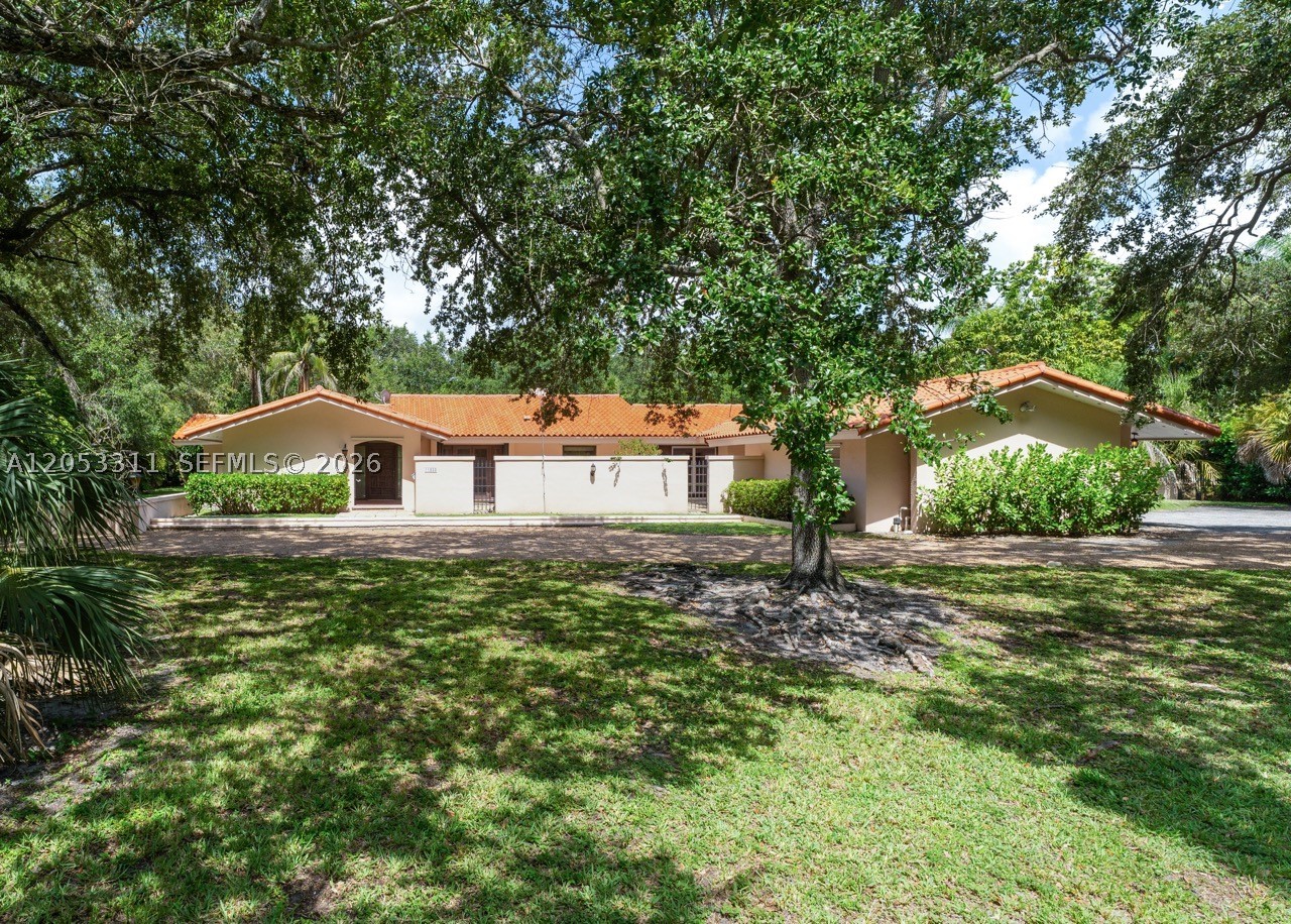 Exceptional opportunity on a magnificent 39,255-square-foot lot in the heart of central Pinecrest. The existing residence offers approximately 4,100 square feet with four bedrooms, three bathrooms, an office/den, a detached two-car garage and a swimming pool. The home features a desirable layout with abundant natural light, dramatic open ceilings and a striking oolitic limestone fireplace that adds warmth and architectural character.

Renovate and reimagine the existing residence, expand the current footprint or create a completely new vision for the property. The expansive grounds provide tremendous flexibility for additional living space, outdoor entertaining areas and lush landscaping. A remarkable assortment of mature trees surrounds the perimeter, creating a private and tranquil setting rarely found in such a convenient location.

Located at 11950 SW 67 Court, this unique Pinecrest property presents an outstanding opportunity for homeowners, renovators and builders alike.