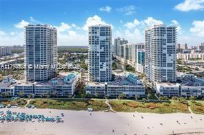 Fabulous upgraded apt in great beach location.  Low floor spacious unit with moderate water views and very close to parking space. Oceania development offers health club, spa, restaurants, tennis, racquetball court, you name it they have it.  Please call 24 hrs in advance, easy to show.  Monthly maintenance is $1,517., Quatertly payments of POA $468. & Club $1,069.  Assessment in place until December 2025 of $1,634.