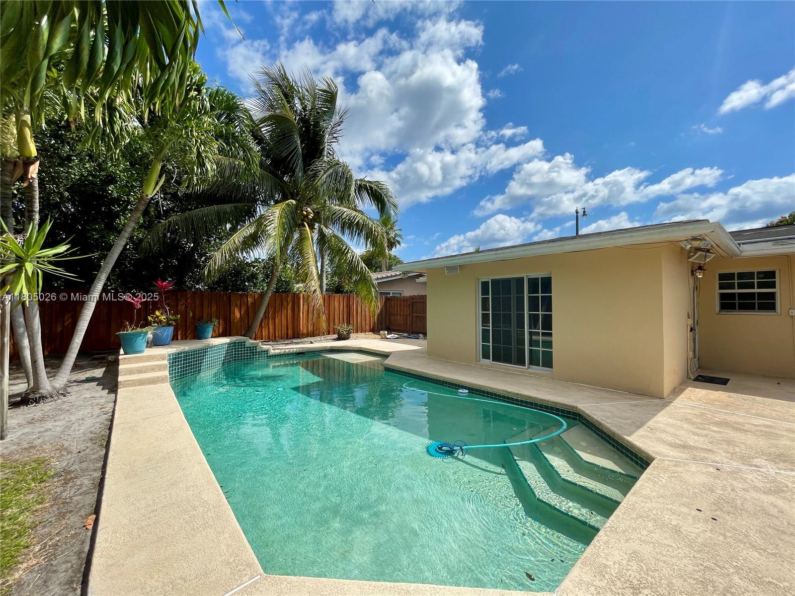 Enjoy Florida living at this pool home located in a quaint and quiet neighborhood, just minutes away from the beach. This midcentury home features a den, a family room separated by French doors from the living and dining area, with direct access to the yard and pool; a main en-suite bedroom also with direct access to the patio; original terrazzo flooring throughout; an attached one-car garage; a dedicated laundry room and much more. Walking distance to restaurants, supermarkets and shopping. Near schools, entertainment and main interstate highways.