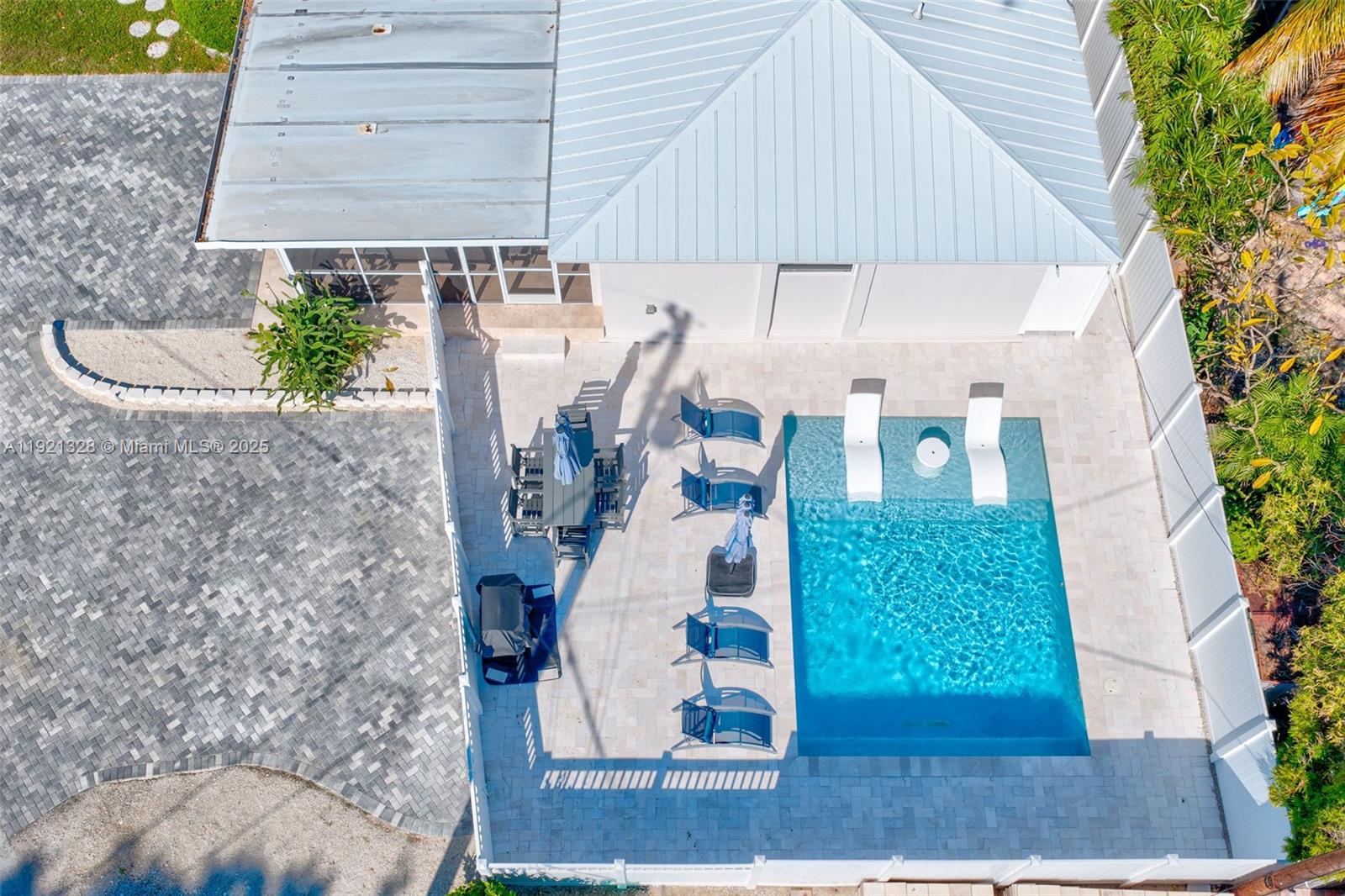 Paradise in an X Flood zone, in one of the sought out communities in Key Largo! Close to the mainland, yet far enough away to feel that Florida Keys Vibe. This home was been COMPLETELY gutted, and turned into the ultimate pool home. Not a single details was overlooked from the pavers, to the impact windows and doors. Screened in porch, which leads to your pool oasis with an outdoor shower. The inviting kitchen with room for everyone. Fenced back yard provides privacy. The primary suite is a MUST See, along with two additional bedrooms. The home owners park features a Tiki Hut and a boat ramp, with easy access to the bay and the ocean. Homeowners park is $150 a year.