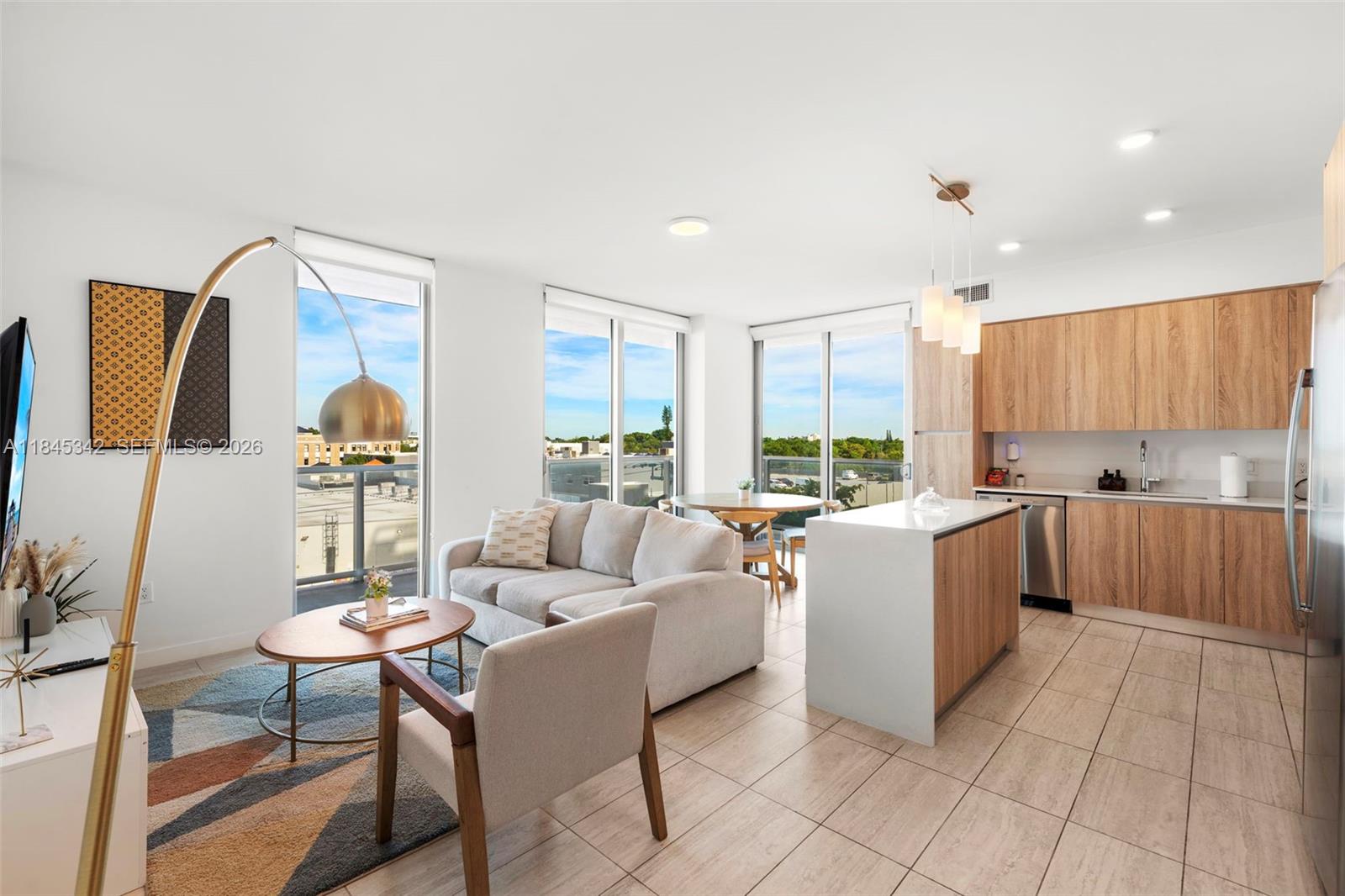 Beautifully furnished 1 Bed + Den corner unit—one of the best lines at Quadro, Miami-Dade's Favorite Condo Silver Award winner (Miami Herald)—with an exceptional layout, floor-to-ceiling windows, and a wraparound terrace with skyline and sunset views. Quadro is AIRBNB friendly with 3-night minimum stays, making it perfect as a second home or income-generating Airbnb. The den fits a full-size bed, offering flexibility for guests or maximizing rental income. Enjoy Italian cabinetry, Nest thermostat, quartz counters, and porcelain floors. Includes assigned parking. Located in the heart of Miami's Design District—walk to art, dining, and fashion. Incredible amenities: resort-style pool, gym, BBQ area, business lounge, air-conditioned bike storage, pet spa, EV chargers, and more.