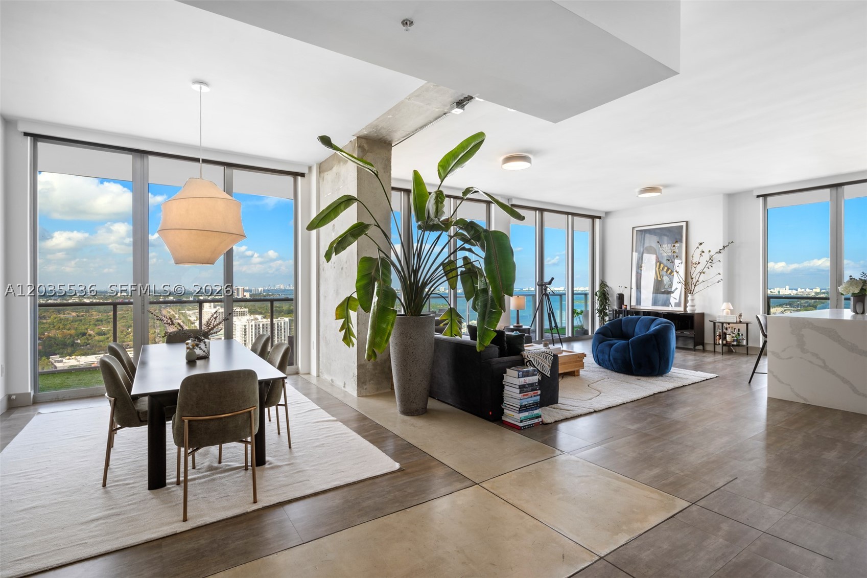 Experience elevated Midtown living at Two Midtown, one of the neighborhood's most sought-after addresses in Miami's most stylish and walkable district. Offered fully furnished and turnkey for a limited summer stay, this beautifully renovated residence has been thoughtfully reconfigured from a 3-bedroom into a spacious 2-bedroom, 2.5-bath home with an open-concept layout designed for effortless living and entertaining.

Floor-to-ceiling glass opens to a deep wraparound terrace showcasing sweeping skyline views stretching from Downtown Miami to Biscayne Bay and the Atlantic Ocean. Inside, designer finishes blend warmth and sophistication, including custom tilework in the kitchen and baths, complemented by exposed concrete details that honor the building's original industrial character.

Residents enjoy access to Two Midtown's resort-style pool and spa, state-of-the-art fitness center, zen lounge deck, and 24-hour front desk.

A rare opportunity to enjoy a fully furnished Midtown residence this summer—available July 1 through September 30 with the possibility of extending through the end of December. Perfect for those seeking a stylish seasonal retreat in the heart of Miami.