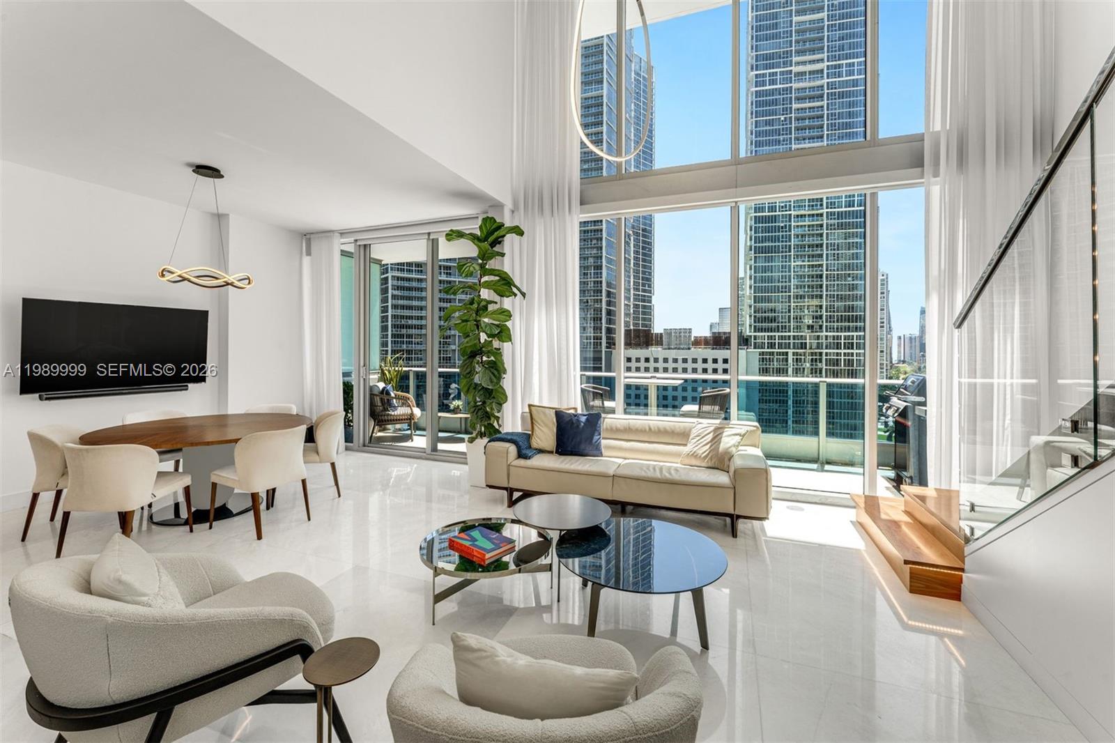 Experience the pinnacle of urban luxury in Loft No. 1406, the highest townhouse-style residence within the iconic EPIC. This masterpiece of modern design has been fully reimagined with over $250,000 in bespoke upgrades, offering an unrivaled sanctuary for those who crave city energy and total tranquility.

Step from your semi-private elevator into a space defined by soaring ceilings and soaring walls of impact glass. Flooded with natural light, the home features professional curation by Addison House and Natuzzi. The rare 3BR/2.5BA layout (including a seamless den conversion) is finished with sleek porcelain tile and a fully integrated Smart-Home ecosystem, controlling lighting, climate, and multi-room sound via built-in speakers. The designer kitchen is a culinary dream, boasting Snaidero cabinetry and top-tier appliances.

Living at EPIC means world-class dining is your "local" spot; you are seconds from Zuma and Area 31. Residents enjoy:

The Pool Deck: A 13,000 SF wrap-around oasis with two infinity pools and private cabanas.

Wellness: Full access to the 12,000 SF Privai Spa & Fitness Center.

The Marina: A 900-linear-foot deep-water marina for effortless yachting.

Elite Services: 24/7 white-glove concierge, valet, and EPIC-Link for on-demand in-home dining, housekeeping, and pet services.

River views. Bay breezes. Zuma downstairs. This is Miami at its absolute peak.