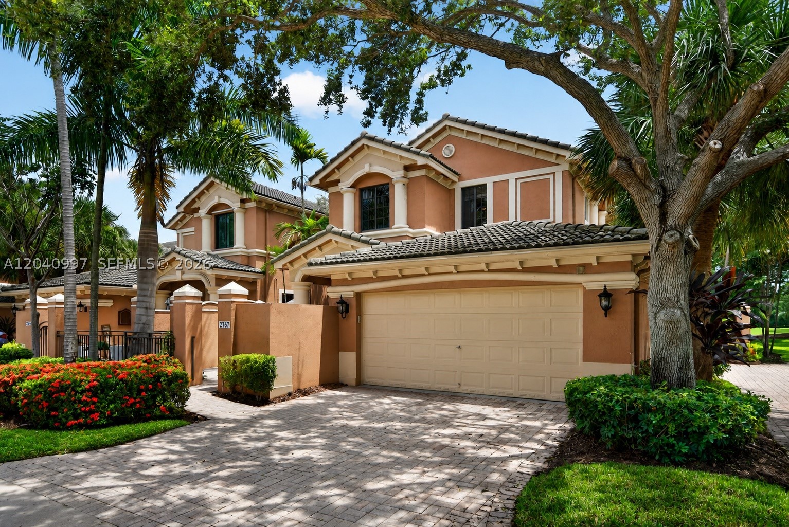 Rare opportunity to own a premium corner residence in The Legends at Weston Hills, one of Weston's most desirable gated communities. Perfectly positioned with sweeping lake and golf views and just seconds from Weston Hills Country Club, this 3 bedroom, 3 bathroom home offers the perfect blend of privacy, luxury, and convenience. Inside, you'll find impact windows and doors throughout, a private elevator, and smart home technology with Alexa compatible switches in the living room, dining room, kitchen, foyer, and patio. A built in Murphy bed adds flexibility to one of the bedrooms, making it ideal for guests, a home office, or a multipurpose space. Step onto the screened in balcony and enjoy peaceful water and fairway views, creating the perfect setting for morning coffee, evening sunsets, or entertaining family and friends. A brand new roof will be installed shortly, providing the next owner with added peace of mind, and the HOA includes exterior insurance, offering exceptional value and convenience. Whether you're searching for a full time residence or a low maintenance luxury retreat, this home delivers an exceptional lifestyle in the heart of Weston. Conveniently located near top rated schools, parks, shopping, dining, and major highways, this is a rare opportunity to own one of the few corner homes in The Legends with both lake and golf views.