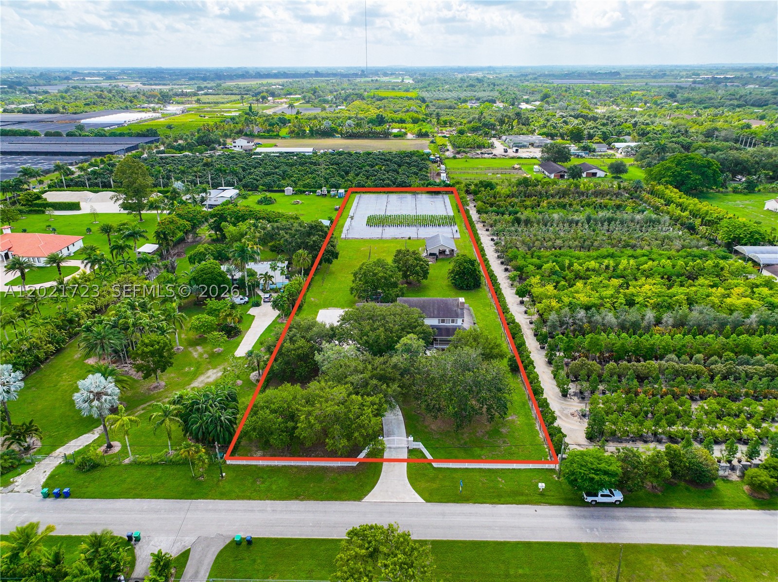 A rare opportunity to own over two acres in the highly desirable Redlands. This unique estate offers exceptional space and flexibility for single-family or multi-generational living. The main residence features 4 bedrooms, 4 full bathrooms, and three oversized flex rooms ideal for guest rooms, home offices, media rooms, or additional living space. Multiple private entrances provide added convenience and privacy. Original wood flooring, two working fireplaces, and rustic farmhouse charm create a warm and inviting atmosphere. Outdoors, enjoy a two-horse stable, mature oak trees, fruit trees, nearly 800 sq ft of enclosed patio space, a wrap-around front porch, RV/boat parking, and plenty of room for a pool, gardens, animals, or future expansion. Zoned agricultural with potential tax benefits, well and septic, and no HOA. A one-of-a-kind property offering privacy, space, and endless possibilities.