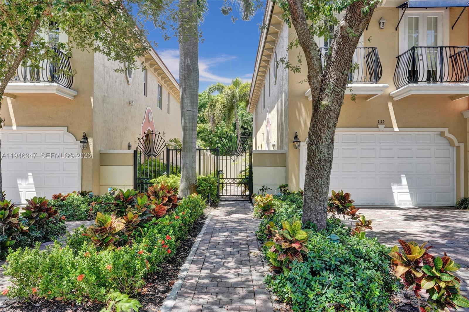 This updated corner townhome combines modern design with comfort, ideal for today’s lifestyle. The open floor plan is filled with natural light, volume ceilings, and sleek finishes. The chef’s kitchen with snack bar offers abundant counter space and flows into the dining area, custom bar, and great room. French doors with impact windows lead to a private tropical retreat featuring an free-form pool, patio, custom BBQ, dining area, lighting, and Bluetooth sound. The primary suite includes two walk-in closets, spa-style bath with Jacuzzi and shower, plus a balcony overlooking the pool. The junior suite has two balconies, and the third bedroom can be used as an office.
