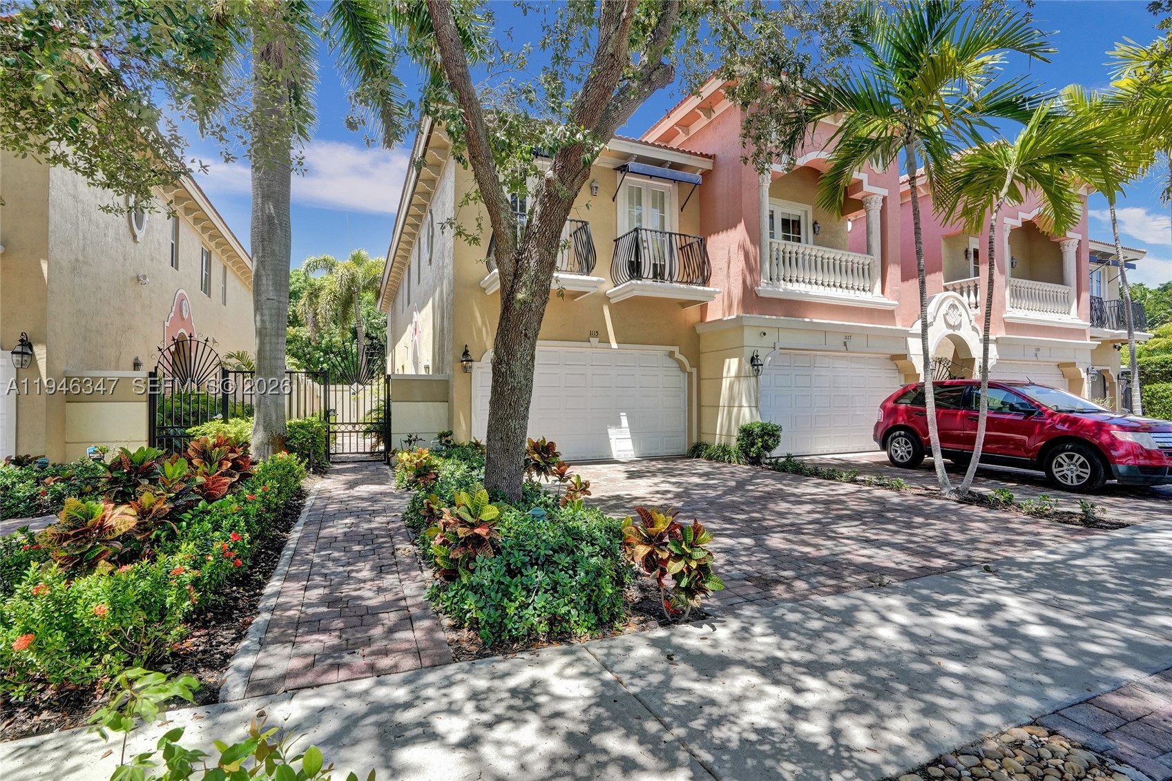 This updated corner townhome combines modern design with comfort, ideal for today’s lifestyle. The open floor plan is filled with natural light, volume ceilings, and sleek finishes. The chef’s kitchen with snack bar offers abundant counter space and flows into the dining area, custom bar, and great room. French doors with impact windows lead to a private tropical retreat featuring an free-form pool, patio, custom BBQ, dining area, lighting, and Bluetooth sound. The primary suite includes two walk-in closets, spa-style bath with Jacuzzi and shower, plus a balcony overlooking the pool. The junior suite has two balconies, and the third bedroom can be used as an office.