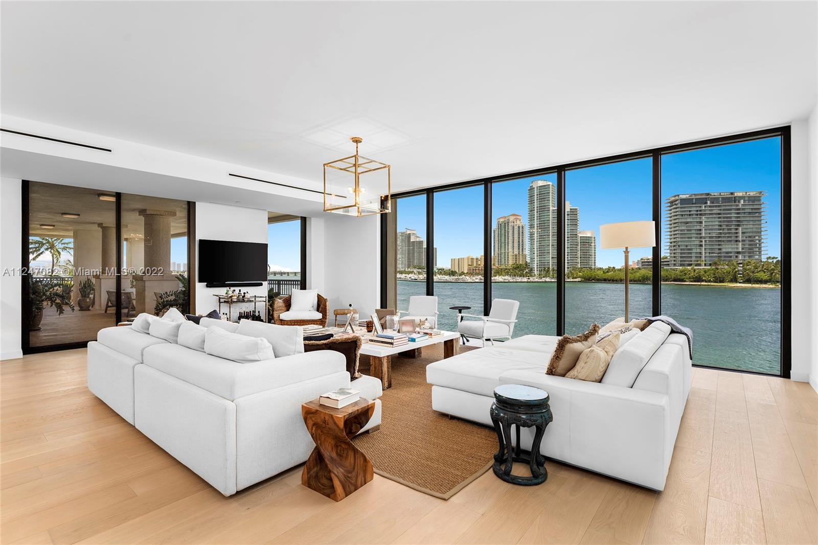 This impeccable designer corner unit at the Palazzo Della Luna is access by private elevator featuring 4BR/4+1BA w/4,904 SF of luxury. Wide plank oak wood floors throughout, spacious extended flow through dining & living room w/access to a wraparound terrace made to entertain w/comfortable seating areas & direct views to Biscayne Bay, Government Cut, Miami Beach & Ocean. Custom Boffi designed kitchen features granite countertops, top-of-the-line Miele & Sub-Zero appliances. Sumptuous principal suite surrounded by walls of glass w/direct water views, dual walk-in closets & stunning bathroom w/Carrara marble rain shower & soaking tub. Three other BR’s are each spacious w/en-suite bathrooms. Wraparound & private back terrace total 2,417 SF. Enjoy 6-star Palazzo amenities & Fisher amenities.