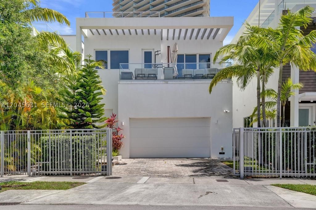 Discover refined coastal living in this beautifully furnished 5-bedroom luxury residence, perfectly positioned in the heart of Sunny Isles Beach just moments from the sand. This rarely available home combines contemporary elegance with everyday comfort, featuring bright, open living spaces, designer finishes throughout, and a stunning modern kitchen equipped with premium appliances for both casual living and sophisticated entertaining. Step outside to enjoy your own private oasis, complete with a sparkling pool, lush landscaping, and an expansive rooftop terrace that's ideal for relaxing, entertaining guests, or taking in breathtaking sunset views. Offering the best of South Florida's indoor-outdoor lifestyle, this exceptional property is located in one of the area's most sought-after beachfront communities, with convenient access to the beach, world-class dining, luxury shopping, and vibrant entertainment, making it an outstanding place to call home.