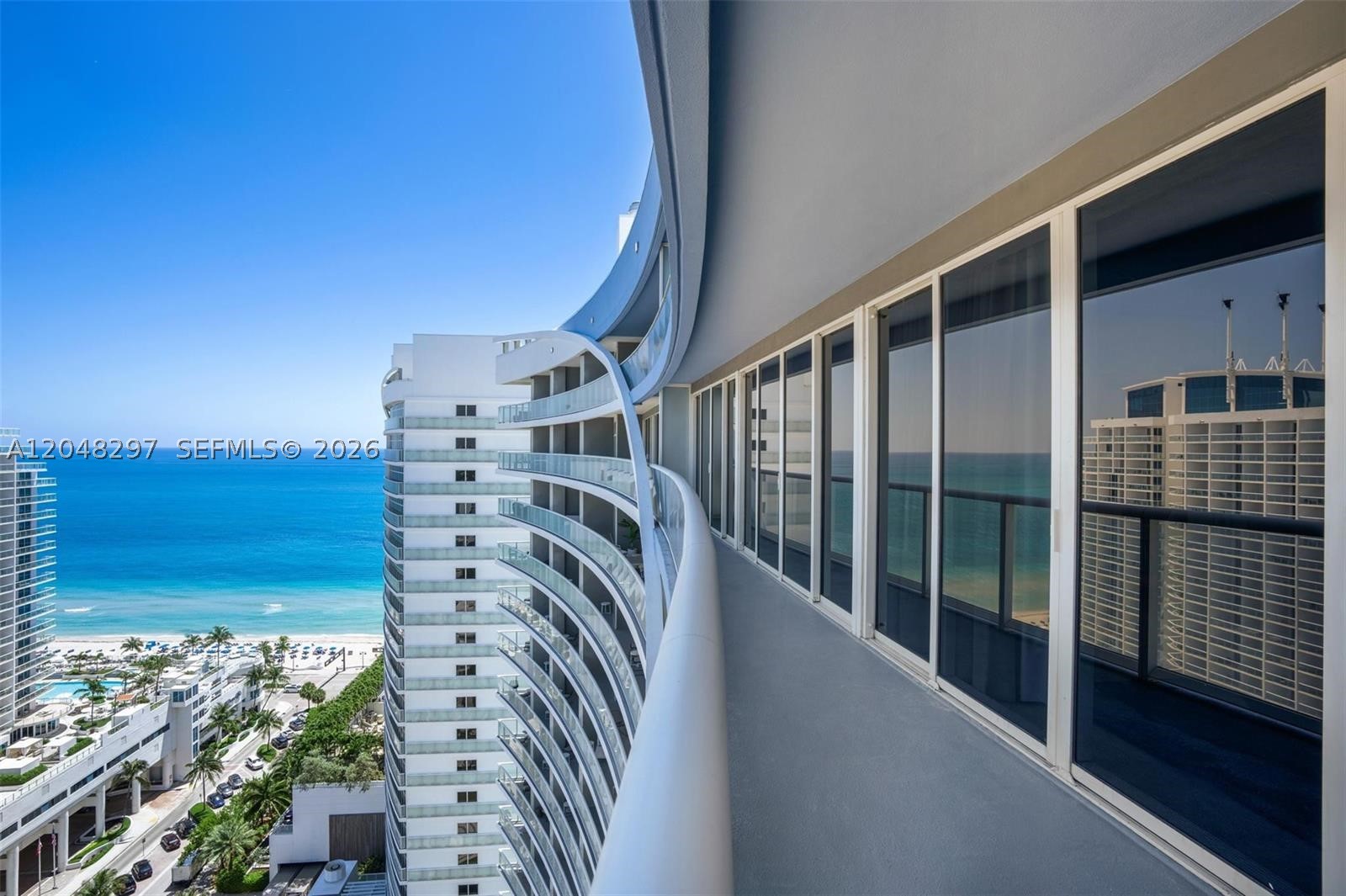 Twenty-three floors above Fort Lauderdale Beach, Residence 2306 at the Residences at W delivers the building's coveted "Ocean Retreat" plan — offered fully furnished and truly turnkey. The 212-sq-ft private terrace runs the full width of the residence, framing ocean, Intracoastal and skyline views from sunrise to city lights. Inside: a split two-suite layout with bedrooms at opposite ends for total privacy, floor-to-ceiling impact glass, marble baths, Italian cabinetry and designer furnishings throughout — arrive with a suitcase and start living. Ownership includes the full W experience: 300+ feet of private beach, two heated oceanfront pools with cabana service, full-service spa and fitness club, Steak 954 by Stephen Starr, 24-hour concierge and valet, and signature Whatever/Whenever® service. An effortless oceanfront residence at one of Fort Lauderdale's most recognized beachfront addresses.