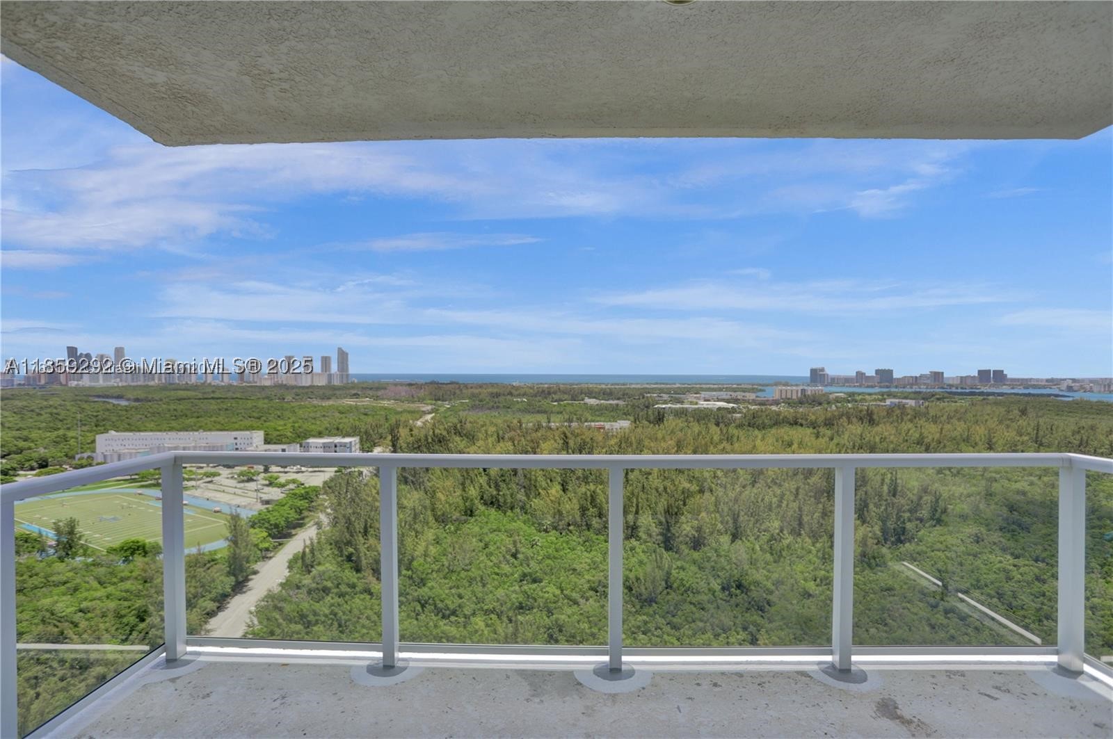 PENTHOUSE! Gorgeous UNOBSTRUCTED VIEWS of Oleta, Intracoastal, & ocean from this large 3-bed/3-bath home. NEW Fridge/ NEW Laundry&Dryer / NEW AC Unit. 1,801 sqft of an open floor plan w/ tile and natural stone floors. Primary bedroom an en-suite bathroom jacuzzi tub & walk-in closet. Assigned Parking spot on the FIRST floor of the garage. Be the first to enjoy the newly installed glass balcony. Building offers fantastic amenities including heated pool, gym, tennis court, playground, and dog washing station. Can pay for 2nd parking spot. Reserve Paddle, Costco, Pura Vida, Target, Publix, new Mater Academy, UM Health, all within a mile & beaches 10 min. away.