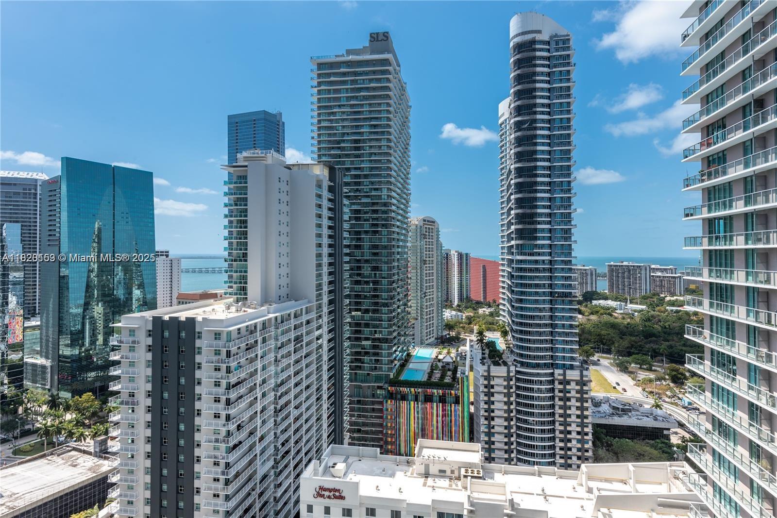 GREAT FOR INVESTORS RENTED UNTIL JULY 2026 FOR $3,200 MONTHLY - Spectacular High-Floor Unit with Stunning Views in the Heart of Brickell!
Welcome to this incredible residence on the 32nd floor, offering breathtaking panoramic views of the bay and city skyline. This spacious and bright apartment features an oversized balcony perfect for entertaining or relaxing above the city.
Inside, you’ll find a sleek European-style kitchen with granite countertops and premium stainless steel appliances. Soaring 9’10” ceilings and floor-to-ceiling windows flood the space with natural light, while the bathrooms are elegantly finished with Italian marble. The open-concept living and dining area leads directly to an expansive 6-foot-deep balcony, a rare feature in Brickell!
