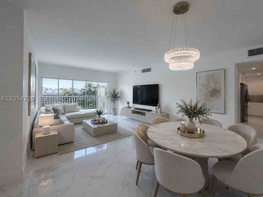Experience elevated waterfront living in this beautifully renovated corner residence featuring an expansive wrap-around balcony with tranquil canal views, lush tropical surroundings, and partial ocean views. Over $80,000 has been invested in a complete, fully permitted renovation, creating a truly move-in-ready home with exceptional attention to detail. This bright 2-bedroom, 2-bath residence offers oversized porcelain flooring, a custom-designed kitchen with premium stainless steel appliances, elegant spa-inspired bathrooms, impact windows and doors, generous closet space, and abundant natural light throughout. Located just across the street from the beach, Arlen House West offers resort-style amenities including 24-hour security, concierge, valet, heated pool, fitness center, tennis courts, marina, library, game room, and beautifully maintained grounds. Ideally situated minutes from Bal Harbour Shops, Aventura Mall, world-class dining, parks, and both Miami and Fort Lauderdale airports. An exceptional opportunity as a primary residence, vacation home, or investment property.
