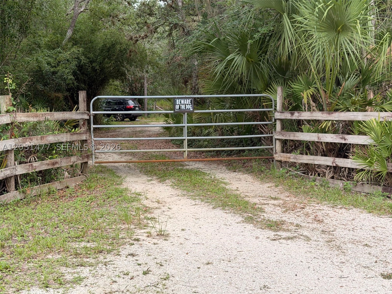 Hard-to-find 5-acre Southwest Florida retreat with utilities already in place. This wooded and partially cleared property offers a peaceful country setting with mature oak trees, Spanish moss, wildlife, and usable open areas. Ideal for a future homesite, mobile home, RV setup, hobby farm, mini-farm, or private weekend retreat. Property features an artesian flowing well that can operate without electricity, complete well filtration system, septic system, electric service, three power poles, and 30-amp and 50-amp electrical connections. Additional features include established plantain trees, a productive 12-year-old mango tree, and a small custom-built barn suitable for storage, hobbies, chickens, or small livestock. Mobile homes and farm animals are permitted. Enjoy privacy and flexibility outside city limits while remaining close to everyday conveniences. Located just 8 minutes from the Sarasota County line and approximately 25 minutes from I-75 Exit 170 in Port Charlotte, with convenient access to shopping, dining, medical facilities, beaches, and recreation. Bring your animals, RV, mobile home, and vision to this usable 5-acre property with major infrastructure already installed.