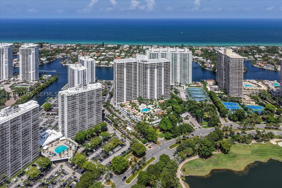 Completely Renovated 2-bed 2-bath Corner Residence with breathtaking direct views of Biscayne Bay, the Intracoastal, Atlantic Ocean, and golf courses. Thoughtfully redesigned with exceptional attention to detail, this home features a beautifully updated kitchen with premium countertops and upgraded appliances, new flooring throughout, additional storage, and an in-unit washer and dryer. Both bathrooms are stunning with high-end finishes. Enjoy spectacular sunrises and tranquil water views from two private balconies. Ideally located just minutes from Aventura Mall, beaches, parks, golf, fine dining, and entertainment. Community pool and amenities are currently being renovated to enjoy for years to come. The special assessment has been paid in full by the owner, offering added peace of mind. A truly move-in-ready home that must be seen in person to be appreciated.