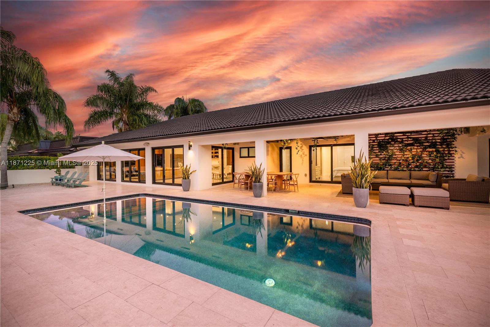 This 4-bed, 4-bath Miami Waterfront Modern Masterpiece, completely renovated, pairs sleek interiors with resort-style outdoor living. Walls of glass flood the home with natural light and frame stunning wide-water views. The chef’s kitchen boasts an oversized waterfall island, custom cabinetry, and premium appliances. Outside is where the magic happens: sparkling pool with in-water loungers, sandy fire pit lounge, summer kitchen, and an extensive covered patio built for entertaining. With 70 ft of prime waterfront and direct Intracoastal access/no fixed bridges, it’s a yacht owner’s dream. Perfectly placed minutes from Sunny Isles, Bal Harbour, and Aventura—this turnkey showpiece delivers the ultimate Miami lifestyle with unbeatable long-term value. Boat Dock to be built.