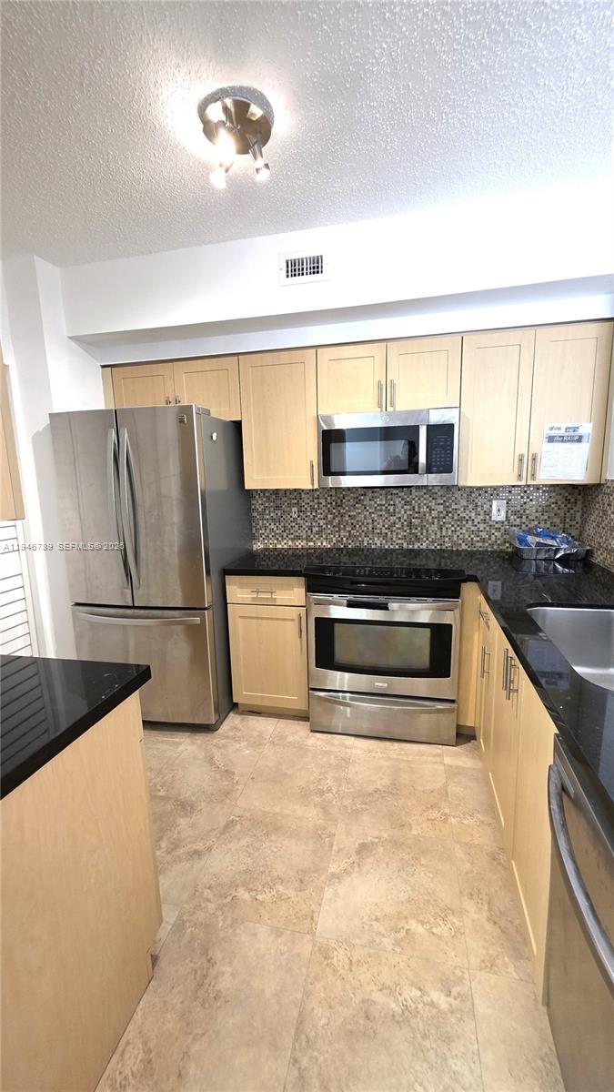 Gorgeous upgraded unit in the heart of Miramar! Bright and spacious 3-bedroom, 2-bath residence featuring a modern kitchen with stainless steel appliances and black granite countertops. Open layout with abundant natural light. Located in a desirable gated community offering resort-style amenities including swimming pool, jacuzzi, fully equipped gym with weight and cardio areas, tennis courts, and children’s playground. Prime location just minutes from Pembroke Lakes Mall and Pembroke Gardens, with easy access to the Turnpike and I-75. Conveniently located near the Miami-Dade County line, offering unmatched accessibility and comfort. No rental restrictions – unit can be rented immediately, making it an excellent opportunity for both end-users and investors. Enjoy space, upgrades, amenities, and one of the best locations in the area.