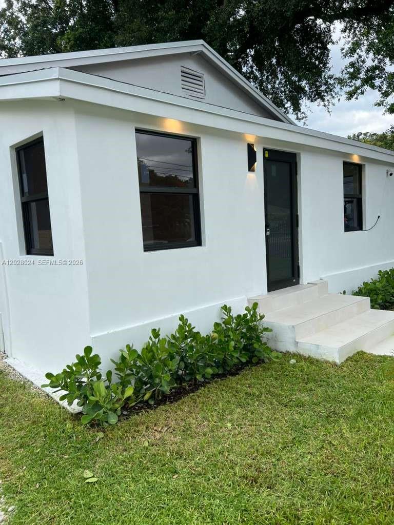 ATTENTION! Investors and Buyers seeking a primary residence with built-in income potential. Fully renovated, move-in ready property in Miami's rapidly evolving 33127 area, just minutes from Wynwood and the Design District.The main residence features 3 bedrooms and 2 bathrooms with a modern open layout, brand-new kitchen with stainless steel appliances, porcelain tile flooring throughout, impact windows and doors, and a new roof-offering the feel of new construction. What truly sets this property apart is the independent Guest suite with private entrance, spacious bedroom with full bath, kitchenette , mailbox and independent electric meter offering excellent rental income potential or flexible living space extended family. 
Perfect for: Buyers looking to significantly offset their monthly mortgage; Multi generational living; Flexible use as guest suite or long-term rental.
Located in a duplex-zoned area, offering additional future development potential. ''No HOA fees and restrictions''
A unique opportunity to own a versatile property in one of Miami's most dynamic and growing neighborhoods.
photos are virtually staged to show the home's potential.