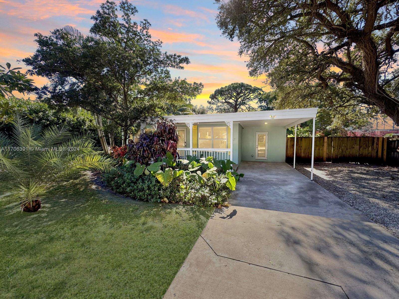Check out this stunning, renovated 2/1 home in Fort Lauderdale! This beautiful property has full impact windows and doors for added peace of mind, a completely renovated interior with modern finishes, and a spacious porch where you can enjoy your morning coffee or evening sunsets. Relax on the deck or host in your very own private beach area in the yard—the perfect spot for entertaining or kicking back and enjoying the Florida weather. The outdoor living space offers many areas to hang out and enjoy, all with no HOA. The home also features a separate dining room, a fully equipped kitchen with everything you need, tropical foliage that brings the island vibes, a carport, a long driveway that provides ample parking, a laundry room, and a gated property for added privacy.