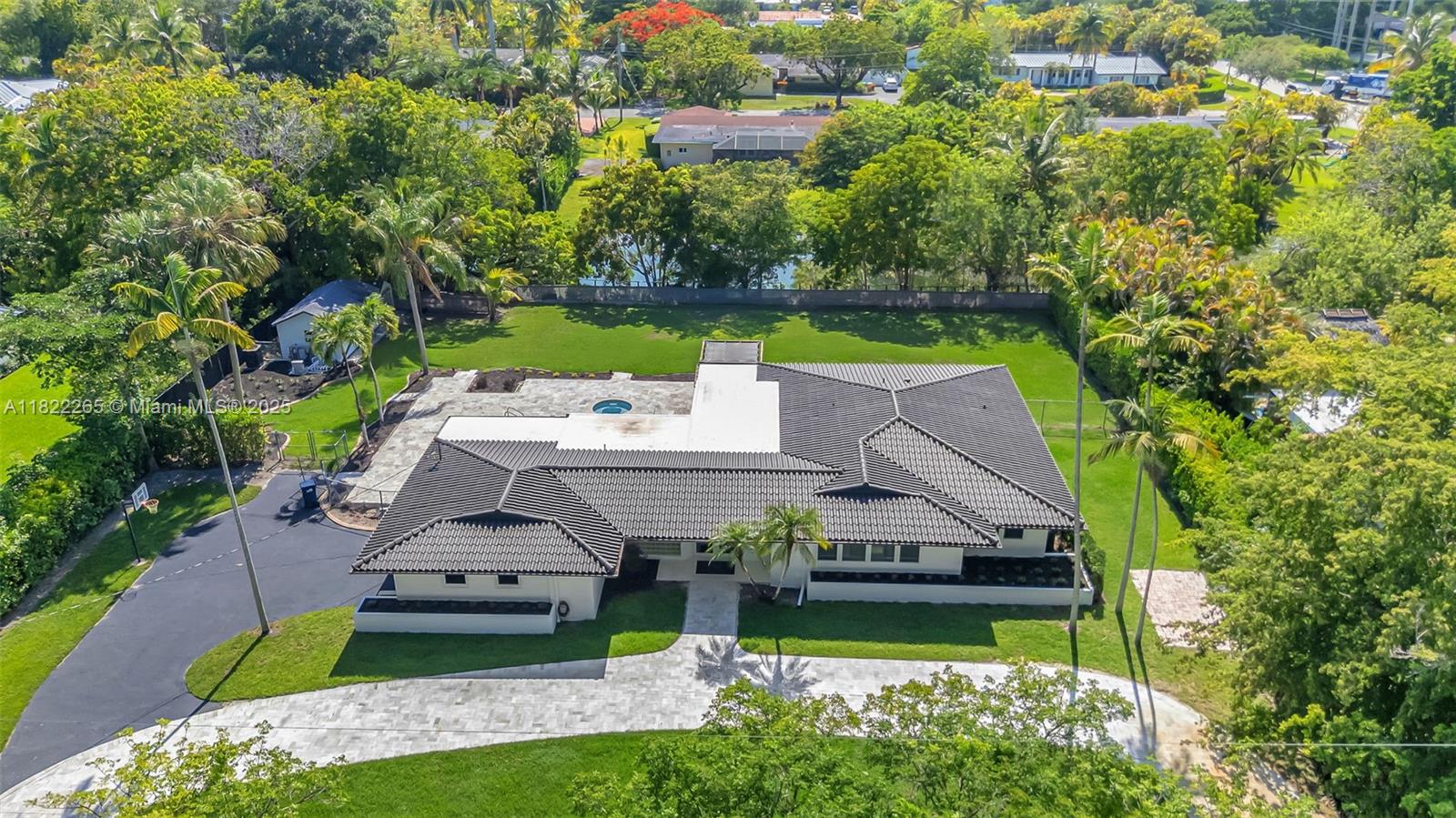 DREAM PROPERTY! PERFECT FOR FAMILIES, INVESTORS, OR SPEC BUYERS. WITH RECENT $500,000 UPGRADES, THIS SPACIOUS HOME ON A LARGE 30,000 SQ FT LOT OFFERS 3 BEDROOMS, 3 BATHROOMS, PLUS AN OFFICE OR 4TH BEDROOM, ENSURING ULTIMATE FLEXIBILITY & FUNCTIONALITY, WITH AIR-CONDITIONED 2-CAR GARAGE INCLUDES EPOXY FLOORING, TESLA CHARGER, SINK, GYM, TV, COUCH, & BIKE RACK. EVERY WINDOW & DOOR IS HURRICANE IMPACT RESISTANT FOR PEACE OF MIND.

THE RESURFACED POOL, SURROUNDED BY A MARBLE TRAVERTINE PATIO, ENHANCES THE OUTDOOR SPACE. THE BIG BACKYARD ON A CANAL, ALONG WITH A BASKETBALL COURT, SECURE GATED ENTRANCE WITH A CIRCULAR DRIVEWAY PAVED IN MARBLE, ON A QUIET CUL-DE-SAC, NEAR SCHOOLS & SHOPPING, ADD TO THE PROPERTY’S APPEAL. PLUS, WITH AN IRRIGATION SYSTEM & HOME SECURITY SETUP, IT'S MOVE-IN READY.