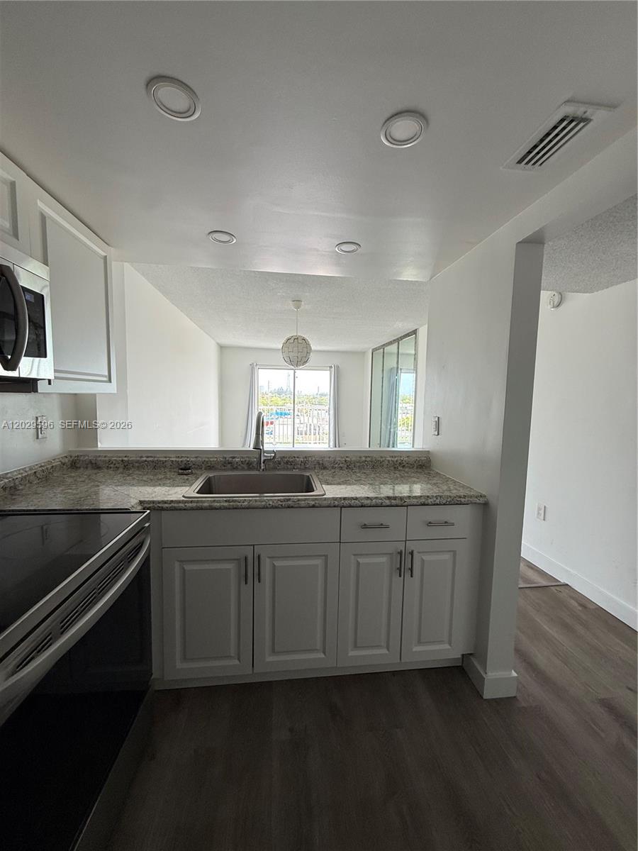 Beautifully updated 1-bedroom, 1-bath condo in the desirable Tall Trees community. Renovations completed with permits, offering peace of mind and added value. Features include an updated kitchen with modern cabinetry and appliances, renovated bathroom, upgraded electrical and plumbing components, and stylish finishes throughout. Bright and spacious layout with abundant natural light and balcony access. Conveniently located near Aventura Mall, Sunny Isles Beach, major highways, shopping, dining, and public transportation. Building has completed required inspections and offers secure access, assigned parking, and community amenities. Move-in ready and ideal for both owner-occupants and investors.
The building at 16465 NE 22nd Ave has multiple units that have been marketed highlighting updated interiors, modern kitchens, renovated baths, and recent building improvements, including completion of required inspections.