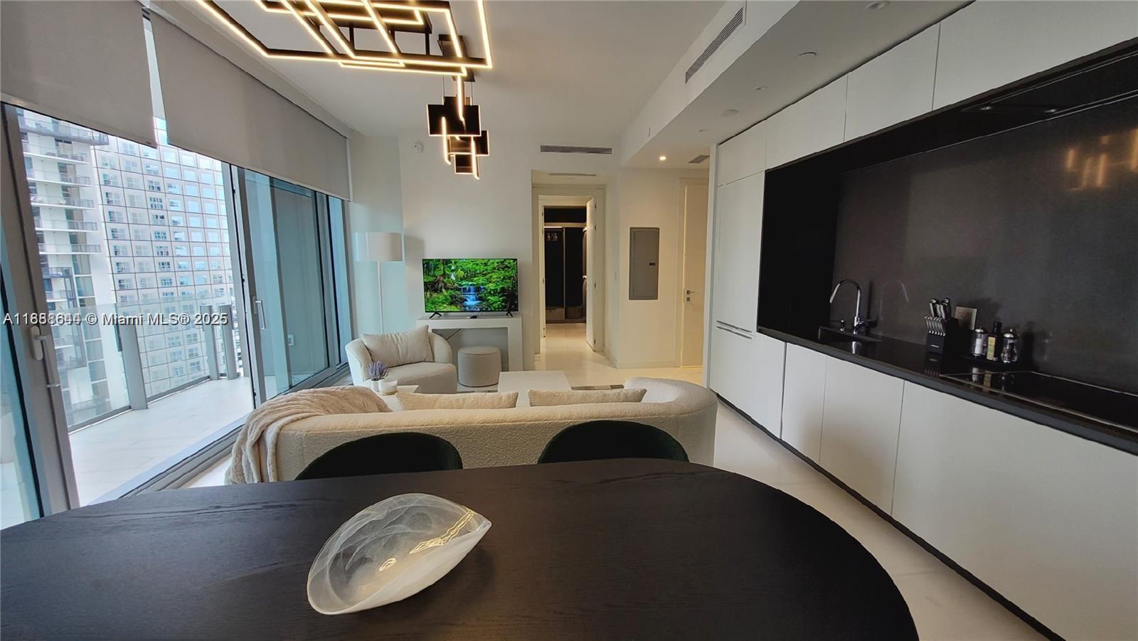 Stunning Turn-key 1 Bed/1.5 Bath at Aston Martin, the British Brand has opening with more flashy features than could ever dream of. Located on 29th Floor with amazing skyline views and large terrace. This condo offers light-filled, open living spaces w/ volume ceilings and high-end finishes & fixtures throughout. Custom walk-in closet, Monitorized Windows Shades, Designer Lamps, Floor to ceiling Mirrors wall -mounted, Luxury kitchen bulthaup cabinetry and Gaggenau appliances and the premium marble flooring. 4 floors of sky amenities: Infinity Pool, Private Pool Cabanas, Sky Bar & Lounge, His and Hers spas, inclusive saunas, Gran Salon, State -of-the-art- fitness center, Theaters, Golf Simulator, Indoor Pool, Kids & Teens Rooms, Yatch Dockage.