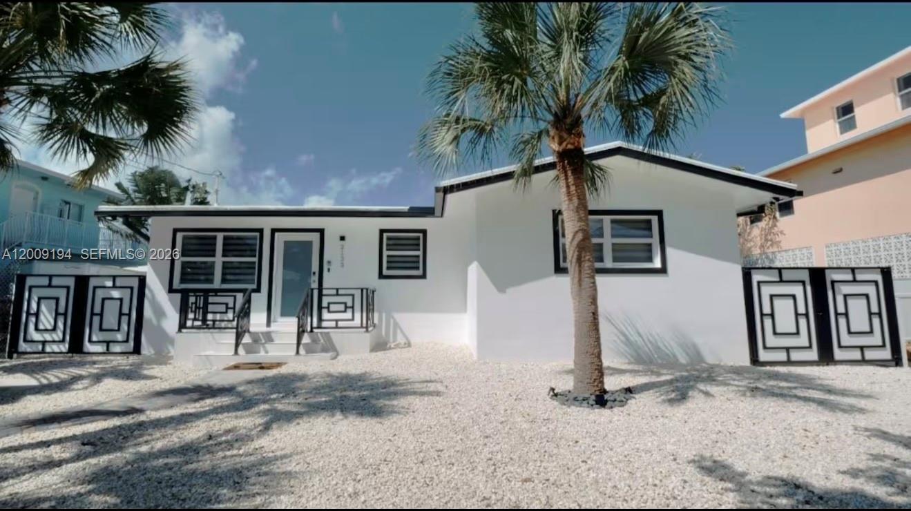 Your Florida Keys Oasis is Here! Welcome to your slice of paradise, where turquoise waters, warm breezes, and endless sunshine create the lifestyle you've always dreamed of. This home offers all the amenities and easy ocean access you need to fully embrace the Florida Keys way of life, on one of the only Gulf Side flow through canals in the Middle Keys. CBS construction on 60 feet of waterfront property with 40 feet of composite dockage and 14K lb boatlift. Enjoy immediate, direct access to the Gulf of Mexico, just minutes to Sombrero Beach, Marathon Jet Center, restaurants, shopping, and world-class diving and fishing. This property is not just a dream home it's a fantastic vacation rental with 7-day minimums and current rentals in place. Don't miss this prime investment opportunity!