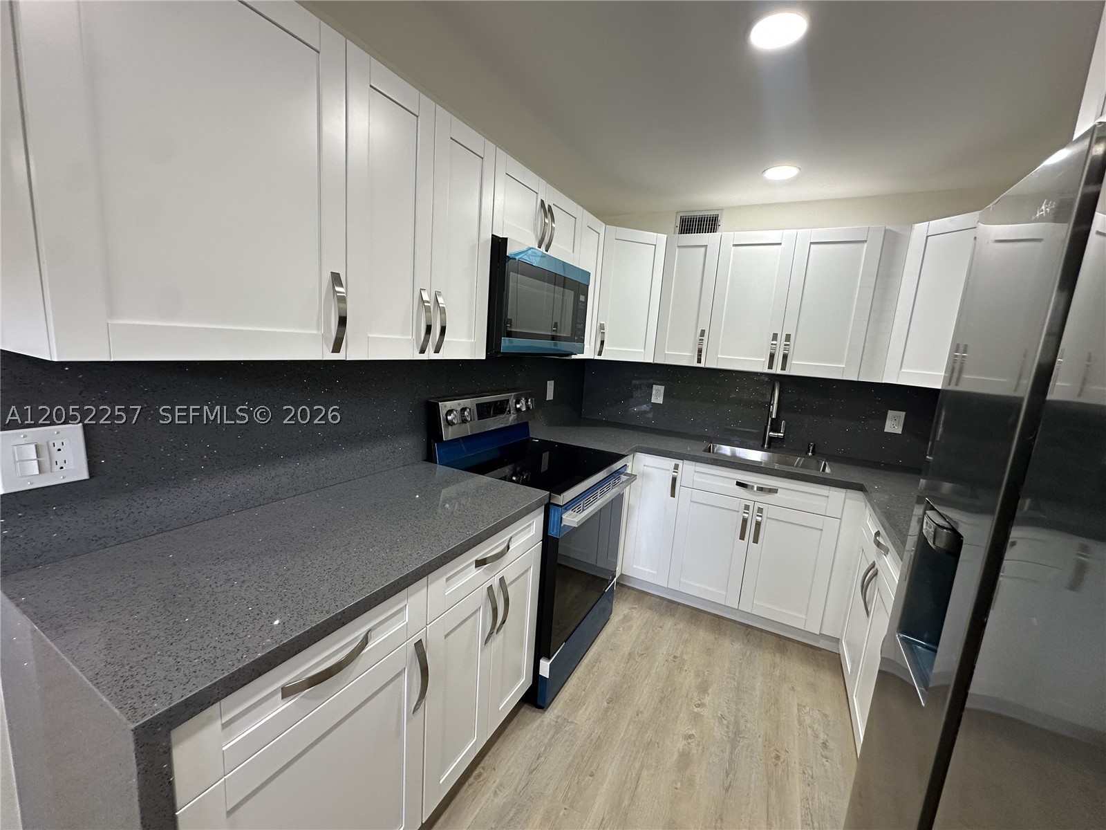 Completely renovated 2BR/1.5BA 1st floor unit with breathtaking panoramic golf course and lake views. This move-in-ready home features brand-new flooring, a modern kitchen with granite countertops, new cabinetry, extra storage, brand-new stainless steel appliances,fully remodeled luxury bathrooms with high-end finishes. Smooth ceilings (no popcorn), and modern lighting  throughout add style and comfort. Relax on the private screened balcony and enjoy abundant natural light. Located in the desirable 55+ gated community of Century Village Pembroke Pines, offering resort-style amenities including clubhouse, fitness center, pools, golf, tennis, transportation, and endless activities.