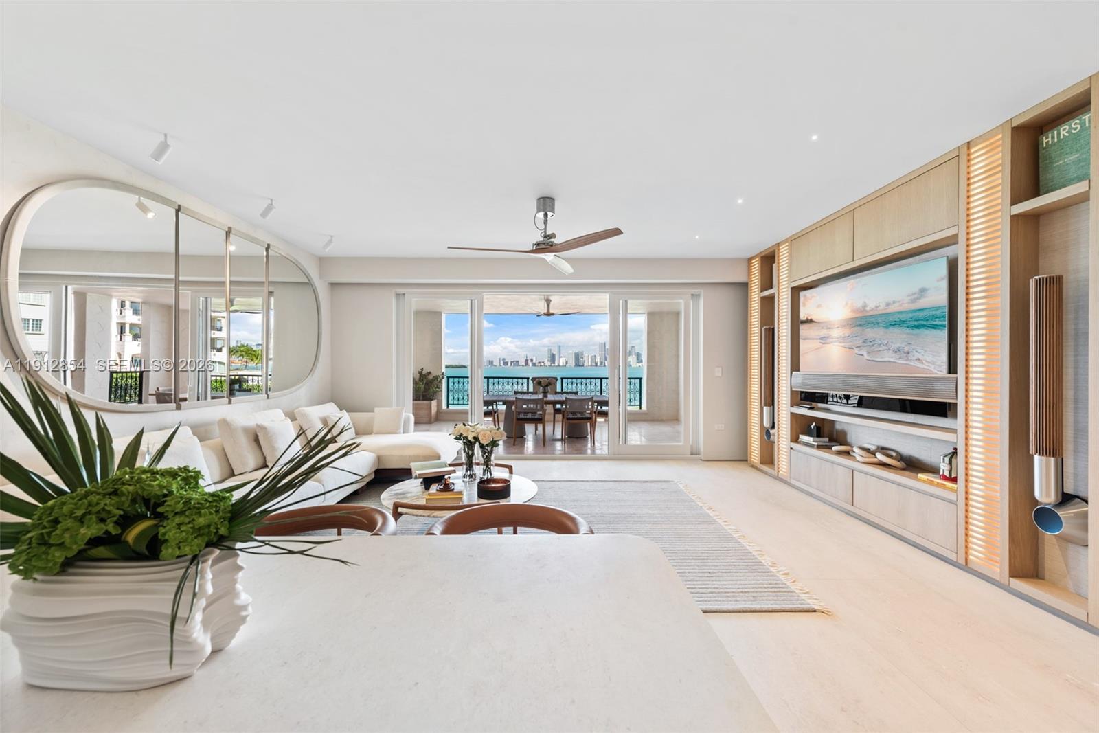 THIS STUNNING BAYVIEW UNIT REDEFINES LUXURY LIVING AT ITS FINEST, LOCATED IN ONE OF THE MOST DESIRED BUILDINGS ON FISHER ISLAND! THIS CONDO HAS BEEN RECENTLY RENOVATED TO PERFECTION & PROFESSIONALLY DESIGNED AND DECORATED. THIS MASTERPIECE OVERLOOKS THE MIAMI DOWNTOWN SKYLINE & BISCAYNE BAY. IT SHOWCASES 3 BEDS /3.5 BATHS, 2,000 SQ FT INTERIOR, EXPANSIVE DOUBLE TERRACES, MARBLE FLOORS, IMPACT GLASS DOORS, A STATE-OF-THE-ART OPEN GERMAN KITCHEN BY BULTHAUP, ITALIAN FURNITURE BY POLTRONA FRAU, CASSINA AND FLEXFORM, ITALIAN DOORS, CLOSETS, BATHROOMS AND FINISHES BY SOLESDI, A NEW HIGH-EFFICIENCY A/C, AUTOMATED WINDOW TREATEMENTS, SPACIOUS MASTER BEDROOM WITH A WALKING CLOSET, ENSUITE BATHROOM IN EVERY ROOM & MANY MORE FEATURES. LIVE THE FISHER ISLAND LIFESTYLE IN THIS EXQUISITE CONDO!
