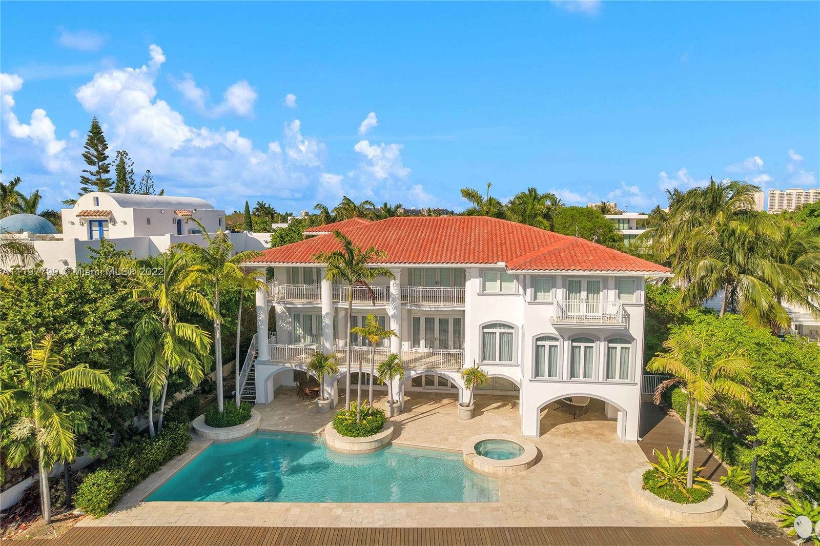 Come experience waterfront living on the Key at its finest! Waterfront Key Biscayne home on Hurricane Harbor with 100 feet of seawall. One minute to the Bay and Ocean. 7 Bedrooms and 7.5 baths comfortably laid out on three floors. The two top floors consist of the living areas and have marble floors, plenty of natural light from the impact windows and doors. Ensuite bathrooms and walk in closets for all 4 bedrooms on the top floor one of which is the primary suite. The home is set back on the 18,734 sq. ft. lot leaving space for a gated circular driveway and three car garage.
