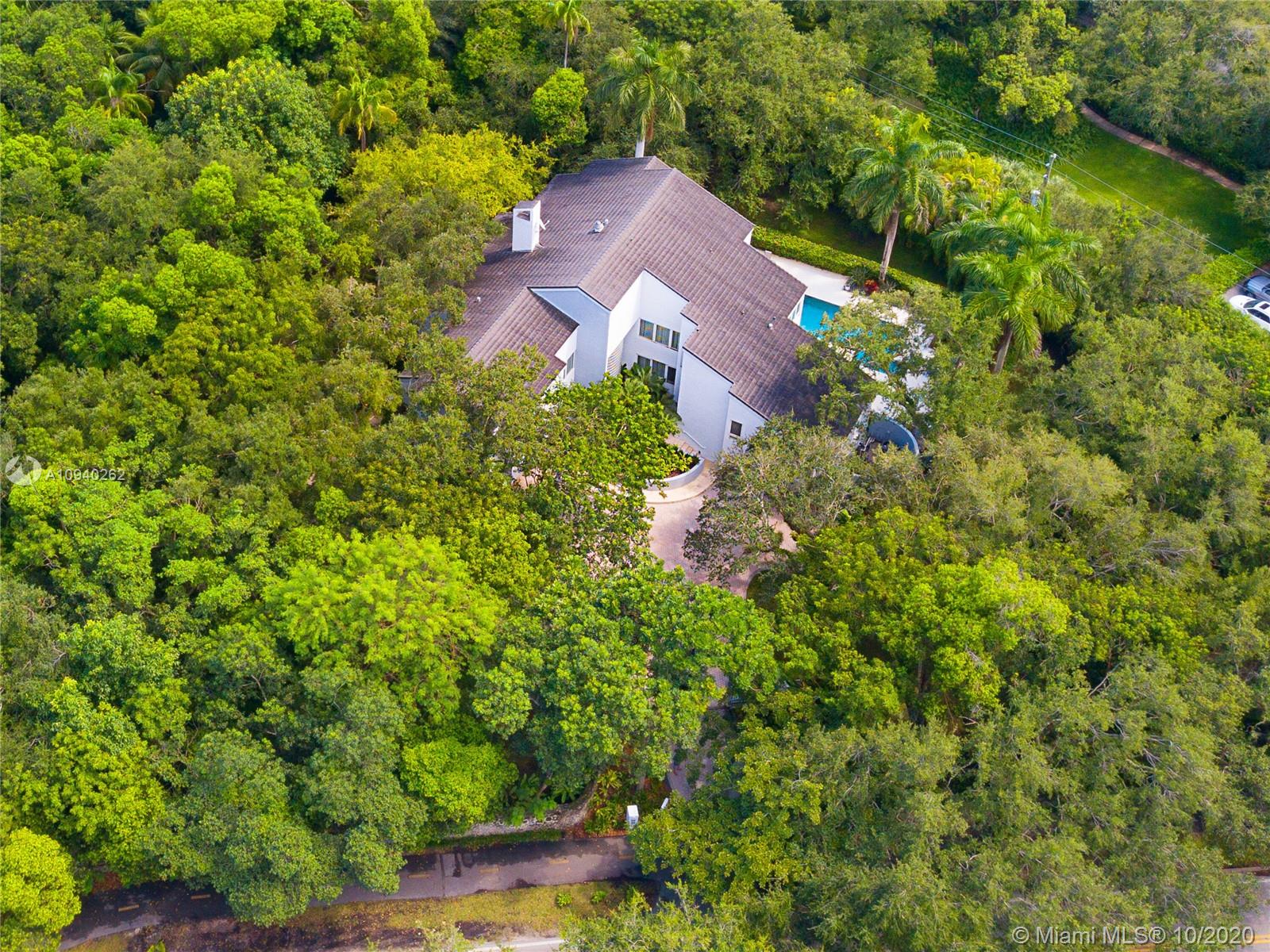 Remarkable Gables Estates property on 1.4 acres with amazing oaks and lovely gardens. Contemporary style home with spacious rooms all offering views of the lush gardens and towering oaks.  Renovated kitchen with top of the line appliances, large master suite with his and her baths, split bedroom floor plan with all bedrooms on the second floor and two beautiful decks that wraps around the first floor. A relaxing and peaceful abode for anyone.