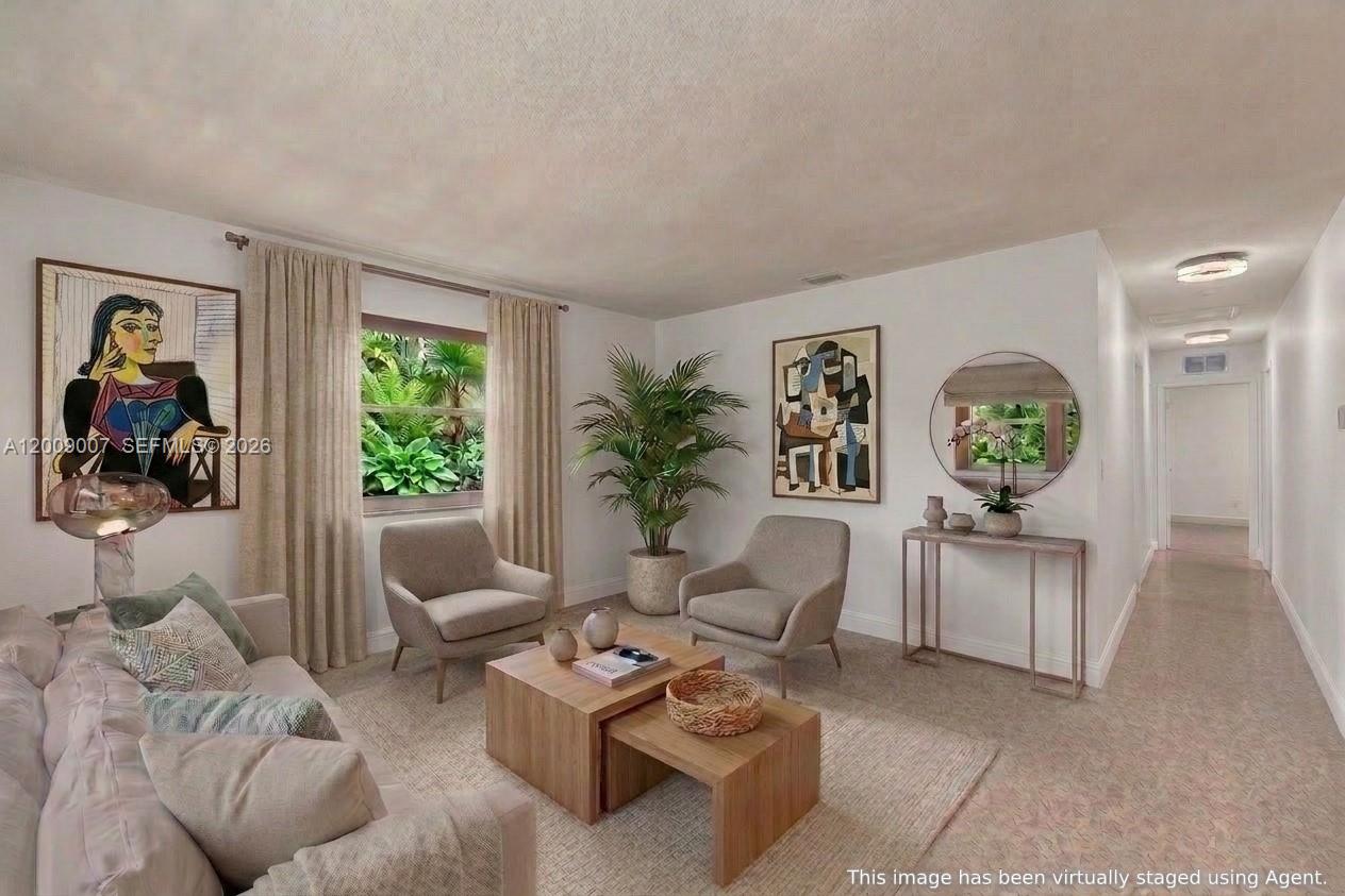 Charming 2-bedroom, 2-bath one-story “doll house” in the heart of South Miami! This well-maintained 1,080 SF home features beautiful terrazzo floors throughout and a versatile family room that can easily be converted back into a third bedroom. The updated kitchen boasts granite countertops and stainless-steel appliances. Additional highlights include a convenient carport, washer and dryer, and a newly installed wooden fence for quiet privacy in the back yard orchid garden. Circular driveway offers ample parking.  This sought-after location is the best residential neighborhood just minutes from excellent restaurants, chic South Miami shops, groceries, and parks. Easy access to primary highways makes this the ideal location, perfect for comfortable urban living!