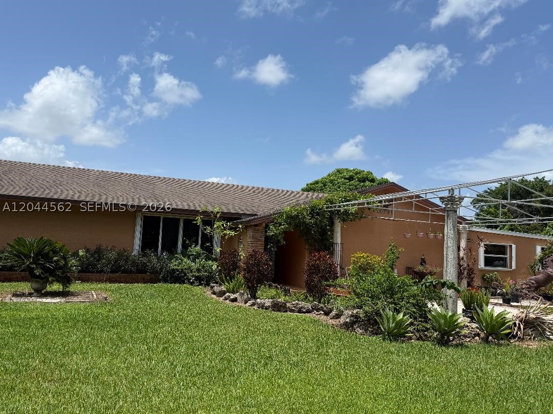 Beautiful ranch-style home in Bonanza Ranch Estates. Main house is 4/2 with an enclosed a/c garage and two formal dining and living areas with a huge master-bedroom, a custom walk-in closet, and his and her shower and vanities. Hurricane shutters on every window and impact doors.guardian gas generator. tankless water heater. washer & dryer. wood cabinets with cordian tops and stainless steel appliances. Terrace outside of master bedroom with jacuzzi.Water softener and sprinkler system. alarm and cameras.Two separate in-law quarters that are being rented for extra income in the rear of the property for a combined of $2500.00 per month. The roof was replaced 8 years ago. pool with jacuzzi. must see to appreciate. The owner is very motivated. This beauty wouldn't last.