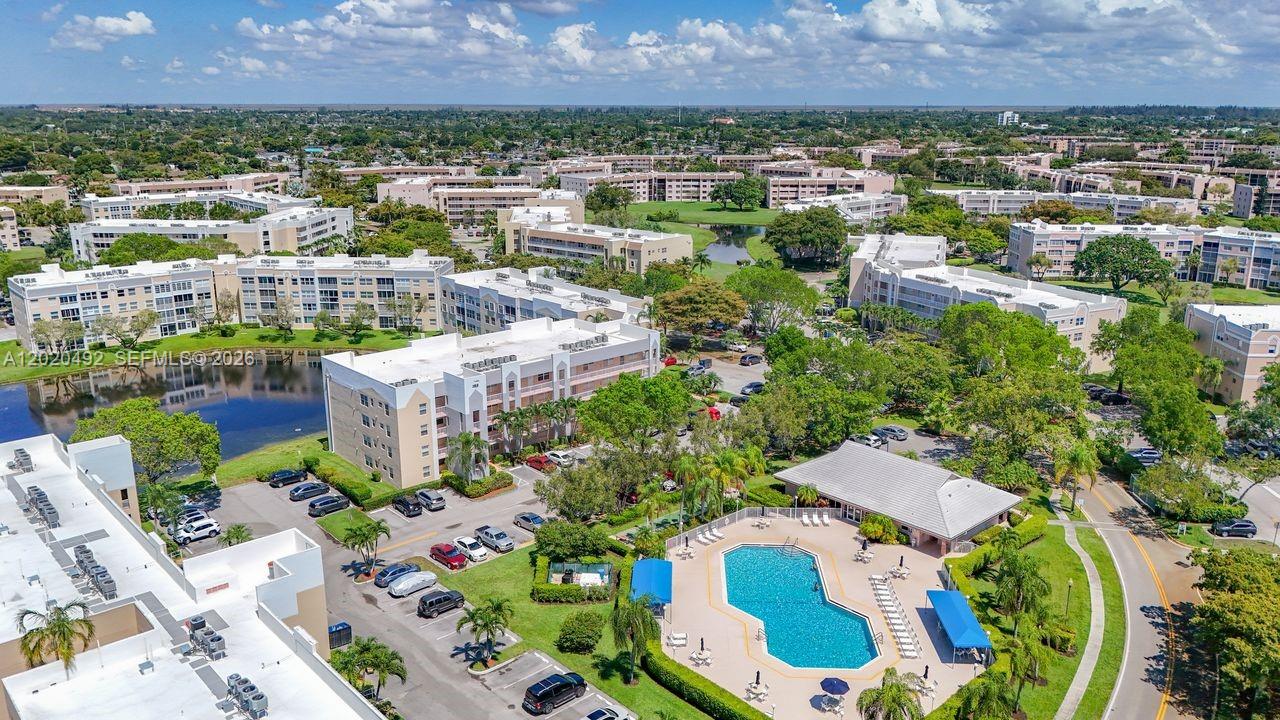 Experience refined living in this elegantly updated 2-bedroom, 2-bath residence showcasing tranquil lake views from the primary suite and sparkling pool views from the kitchen and second bedroom, just steps to the pool. A spacious in-unit laundry room with full-size washer and dryer adds exceptional convenience. The community enhances your lifestyle with a beautifully appointed clubhouse, state-of-the-art fitness center, and a courtesy bus for effortless transportation. The building has recently undergone complete renovations, offering a fresh, modern, and impeccably maintained environment. This is a 55+ community near Sawgrass Mall, restaurants and easy access to highways.