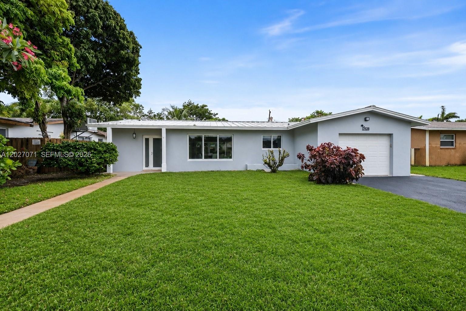 Completely reimagined and renovated from top to bottom, this stunning 3-bedroom, 3-bath residence offers turnkey luxury with no expense spared. Every major component of the home has been upgraded, including a new metal roof, all-new PVC plumbing, new electrical system, impact-worthy improvements, and a fully renovated interior showcasing exceptional craftsmanship throughout.

The designer kitchen features premium custom cabinetry, quartz countertops, and a full suite of high-end appliances. Elegant porcelain tile flooring flows seamlessly throughout the home, creating a modern and sophisticated feel. All bathrooms have been beautifully updated with quality finishes and attention to detail.

Step outside to your private backyard oasis featuring a new pool and hot tub, expansive new paver deck, and a fully fenced yard with a new wood privacy fence—perfect for entertaining or relaxing year-round. A one-car garage provides additional storage and convenience.

This is a rare opportunity to own a truly move-in-ready home where every detail has been thoughtfully upgraded. Ideal as a primary residence, vacation home, or investment property. Simply bring your furniture and enjoy worry-free living for years to come.