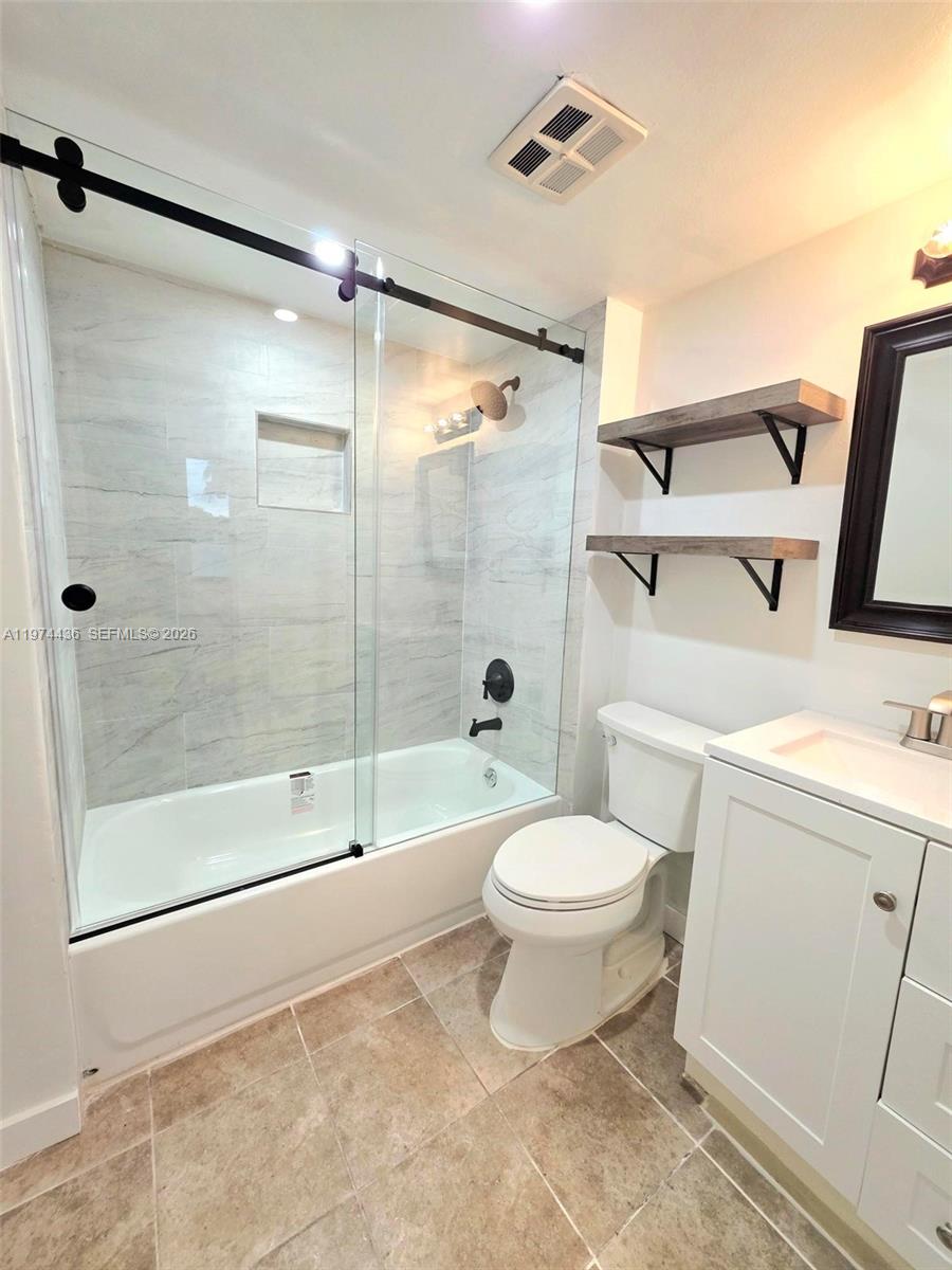 Owner Financing Available!! Beautiful Renovated 2 Bedroom-2 Bathroom Condo in a Very Pet Friendly Community with Water Views - Brand New Impact Windows and Sliding Glass Doors - Brand New Kitchen with Shaker Style Cabinets, Stainless Steel Appliances, and Quartz Counter Tops - Brand New Bathrooms - Brand New Baseboards  Walk-in Closets - Brand New Closet Organizers - Guard Gated Community - Walking Distance to: Royal Palm Park, Stunson Nature Trail, and Oakland Bark (Dog Park) - 5 Minutes from I95 and 15 Minutes from the Beach