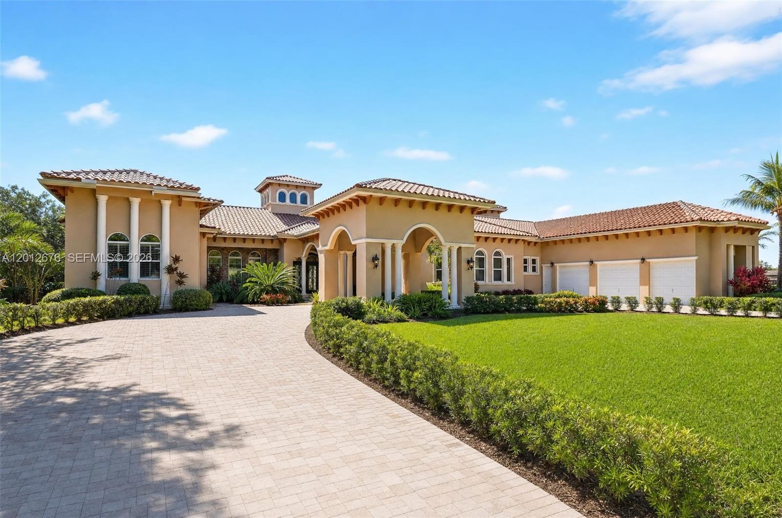 Modern custom estate on 1.07 acres in Pinecrest's Flagler Grove Estates with 9,912 sq ft of living area, 7 bedrooms, 8 full baths and 1 half bath. Built in 2014, this residence includes elevator access, marble flooring, skylights, impact glass and expansive formal and casual living spaces. The kitchen features an oversized island, pantry, gas range and open connection to the great room. Outdoor areas center on an oversized pool with covered patio, balcony and landscaped grounds. Additional highlights include generous bedroom suites, strong storage, a professional theater room, 3-car garage and guest parking. A substantial Pinecrest property with flexible space for office, wellness, media and guests, close to parks, shopping, dining and major Miami corridors.