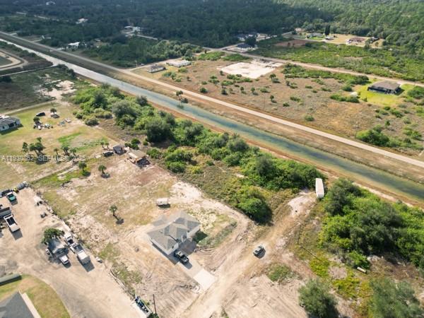 IT DOES NOT GET ANY BETTER THAN THIS, 1.25 ACRE LOT ON A VERY WIDE CANAL. LOTS OF HOUSE IN THE AREA WITH 2 PRESENTLY BEING BUILT NEXT DOOR. 
PAVED ROADS AND DIRT ROADS. THE DIRT ROADS WILL SOON BE PAVED.
ABOUT 15 MINUTES FROM 1-75 AND HWY 82.
THIS LOT IN AT THE END OF THE BLOCK FOR PRIVACY. BUILD YOUR HOMESTEAD HERE AND STILL HAVE ROOM FOR A SHED, WORK VEHICLE, ETC.
CALL LA FOR INTRODUCTION TO BUILDER FOR COST OF NEW HOUSE.