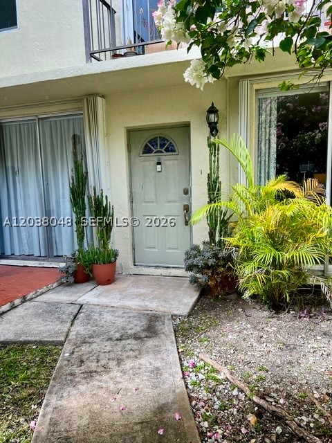 Beautifully and tastefully remodeled one-bedroom apartment just steps from the bay. This stunning home features custom closets, quartz kitchen countertops, rich wood self-closing cabinetry, and top-of-the-line appliances. Enjoy the convenience of a dedicated laundry room with additional storage space, a huge bedroom, and a spacious open floor plan designed for comfortable living. Outside, a fenced front yard offers added privacy, while covered parking is located right outside your back door for everyday ease. Current special assessment for 30K will be paid in full by owner at closing. A rare opportunity to enjoy stylish living in an unbeatable location near the water