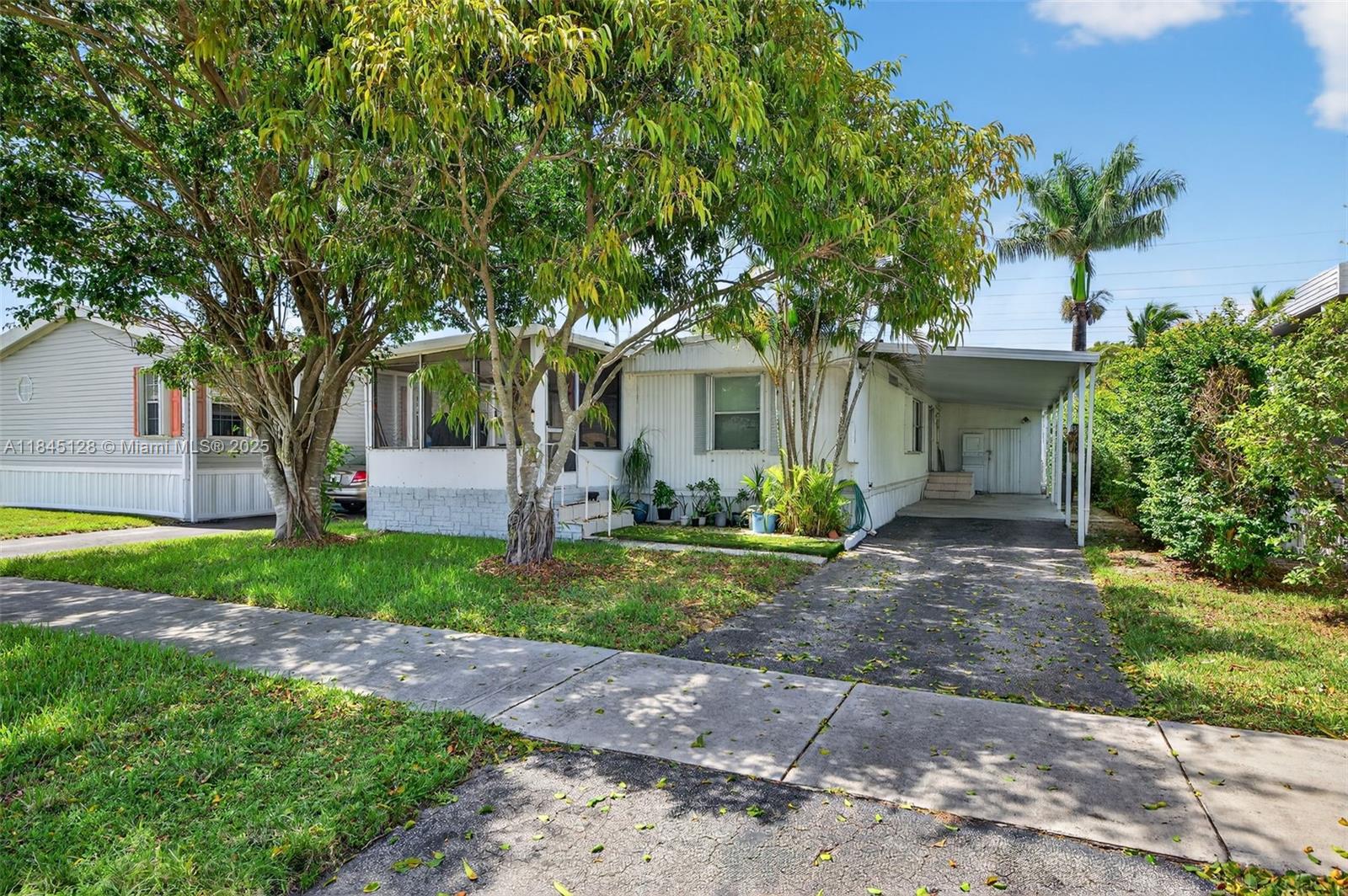 ONE OF THE BEST LOTS IN ALL OF RAVENSWOOD! ONE OF A FEW PROPERTIES HERE WERE YOU HAVE A NICE BACK LAWN AREA FOR MORE ENJOYMENT.  YOU OWN THE LAND HERE AS WELL. THIS IS ONE OF THE NICEST, MOST ESTABLISHED MOBILE HOME PARKS IN ALL OF SOUTH FLORIDA. THIS CAN BE A GREAT PRIMARY RESIDENCE, SEASONAL RESIDENCE, VACATION HOME OR INVESTMENT. THE PROPERTY RIGHT NOW IS TENANT OCCUPIED AT $2000.00 PER MONTH ON LEASE THRU THE END OF AUGUST. TENANTS WILLING TO STAY IF YOU WANT THE INVESTMENT INCOME OR CAN VACATE THEN IF YOU NEED TO OCCUPY. PROPERTY WAS RECENTLY UPDATED WITH NEW FLOORING AND MORE AS OF 2024. THE HOME IS IN GREAT OVERALL CONDITION & THE MOBILE HOME PARK ITS SELF IS IN FANTASTIC SHAPE TOO. THE PARK OFFERS PLENTY OF AMENITIES TO KEEP YOU BUSY AND HAVING FUN. HOA FEE IS ONLY $70 / MONTH.