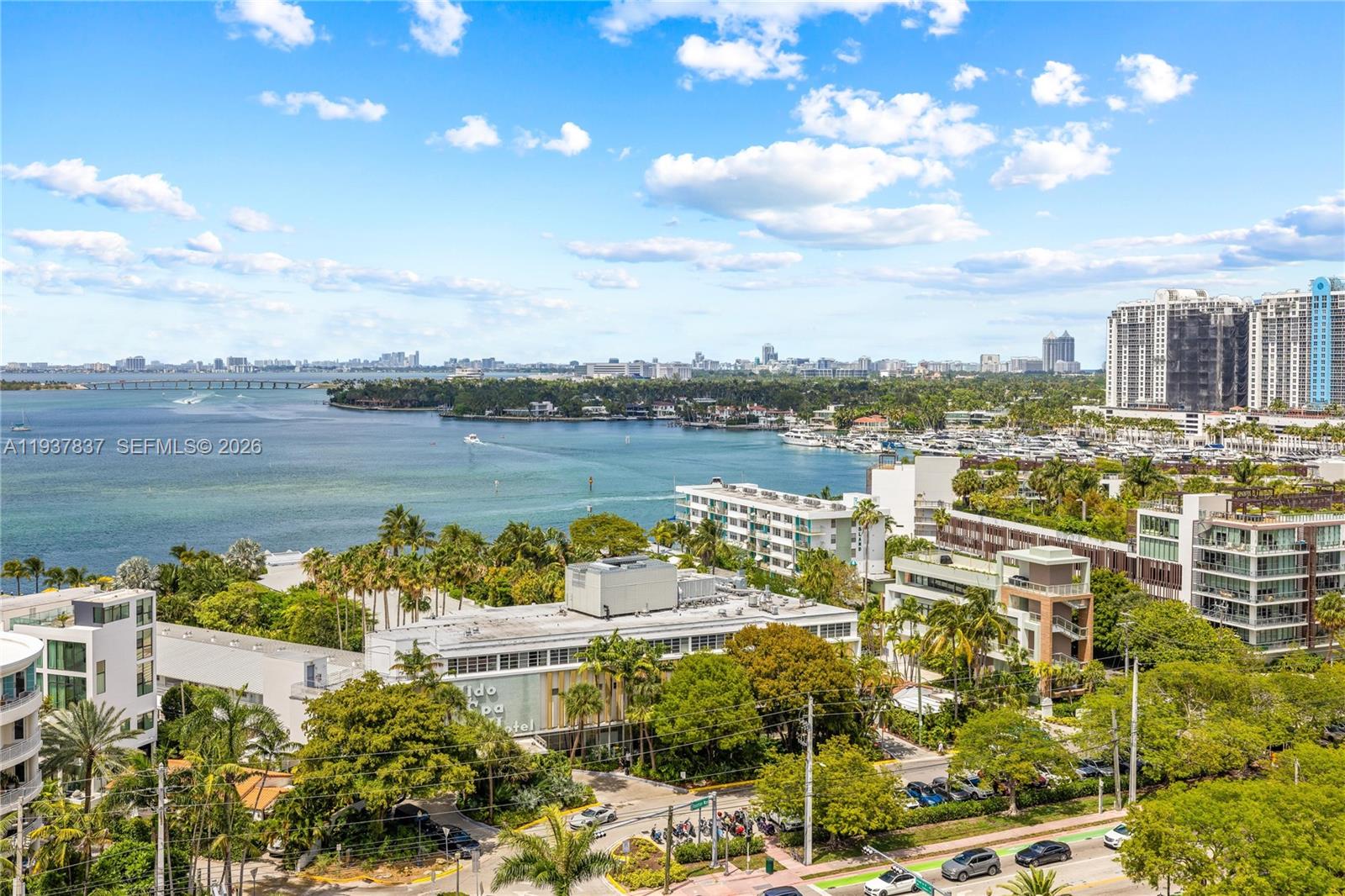 Experience stunning, unobstructed bay views from this beautifully renovated 1-bedroom, 1.5-bath home on Belle Island. Surrounded by green space, parks, waterfront paths, top restaurants, gyms, and boutiques, this spacious apartment offers true community living. Features include a large balcony, impact windows, top-of-the-line appliances, abundant natural light, and ample closet space, plus assigned parking and extra storage. Island Terrace, designed by famed architect Morris Lapidus, offers a bayfront pool, new gym, 24-hour front desk, and onsite management.