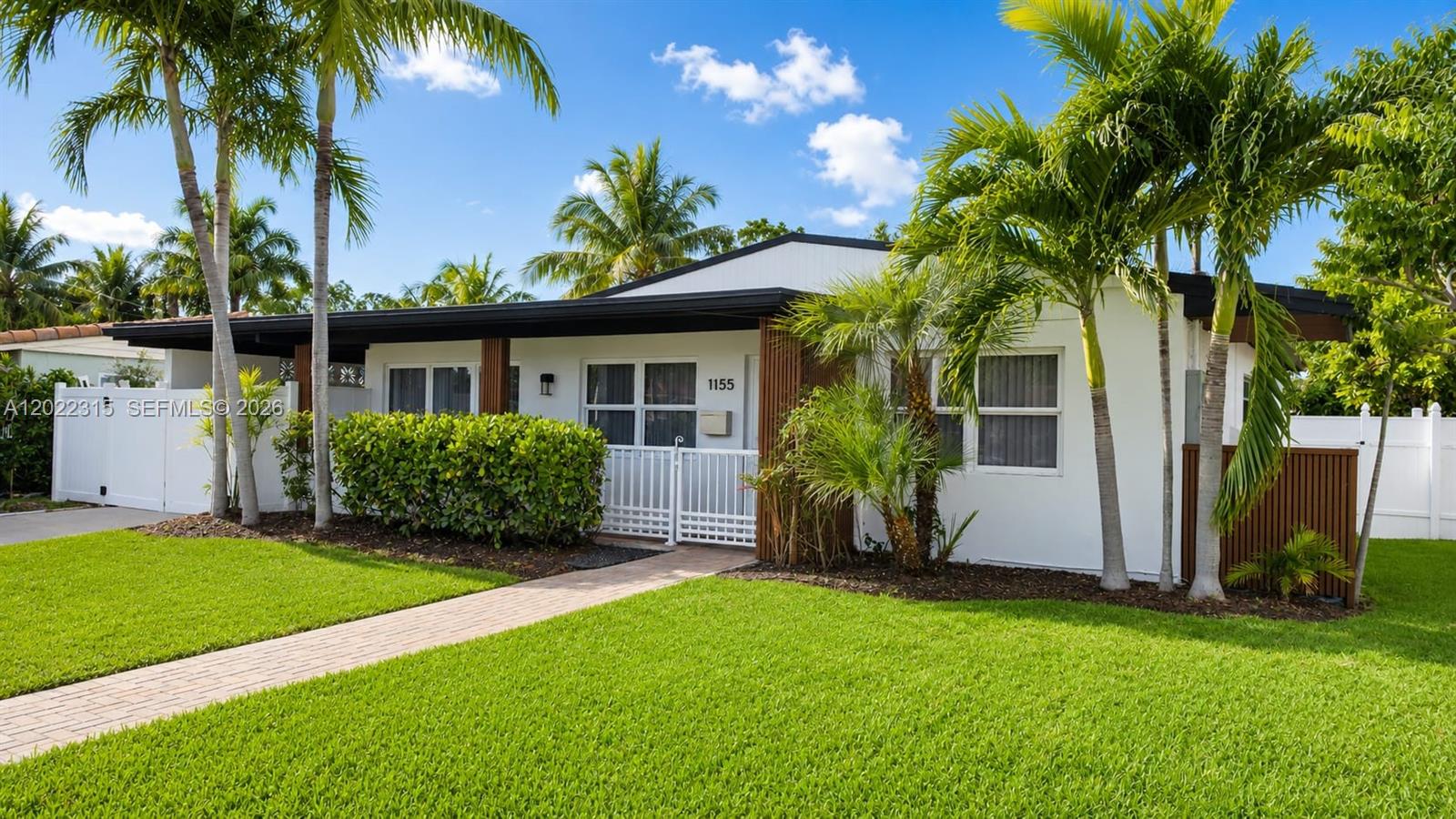 Enjoy this fully remodeled home where every detail is designed for your comfortable living. Situated on the canal and surrounded by the lavish landscape, this house is a true gem. The property's exterior offers the vibrant nature view. The interior features the new AC, new water heater, new electrical panel, new impact windows and doors- all replaced in 2025 and the new roof replaced in 2021. Brand new stainless steel appliances have never been used. Stylish design of the new throughout vinyl flooring reflects the modern ceiling lights. Spacious modern Florida room enclosed with the brand-new screen mesh opens to a large tiled terrace ideal for relaxing, family gathering or entertaining. Gas stove and gas water heaters. The Florida room has a potential to be converted into an additional interior living space, offering approximately 330 sqft for extra bedrooms. Carport for 1 car. Quiet street with no noise of the passing traffic is ideal for a relaxing living. Excellent location near Hollywood Beach Golf Club & Eco Golf Club, close to Holland Park, North Lake Hollywood & Arts Park at Young Circle. Only 5 minutes from Downtown Hollywood & Hollywood Blvd with restaurants, bars, nightlife, entertainment, and shopping. Don't miss this rare opportunity! Won't last long!