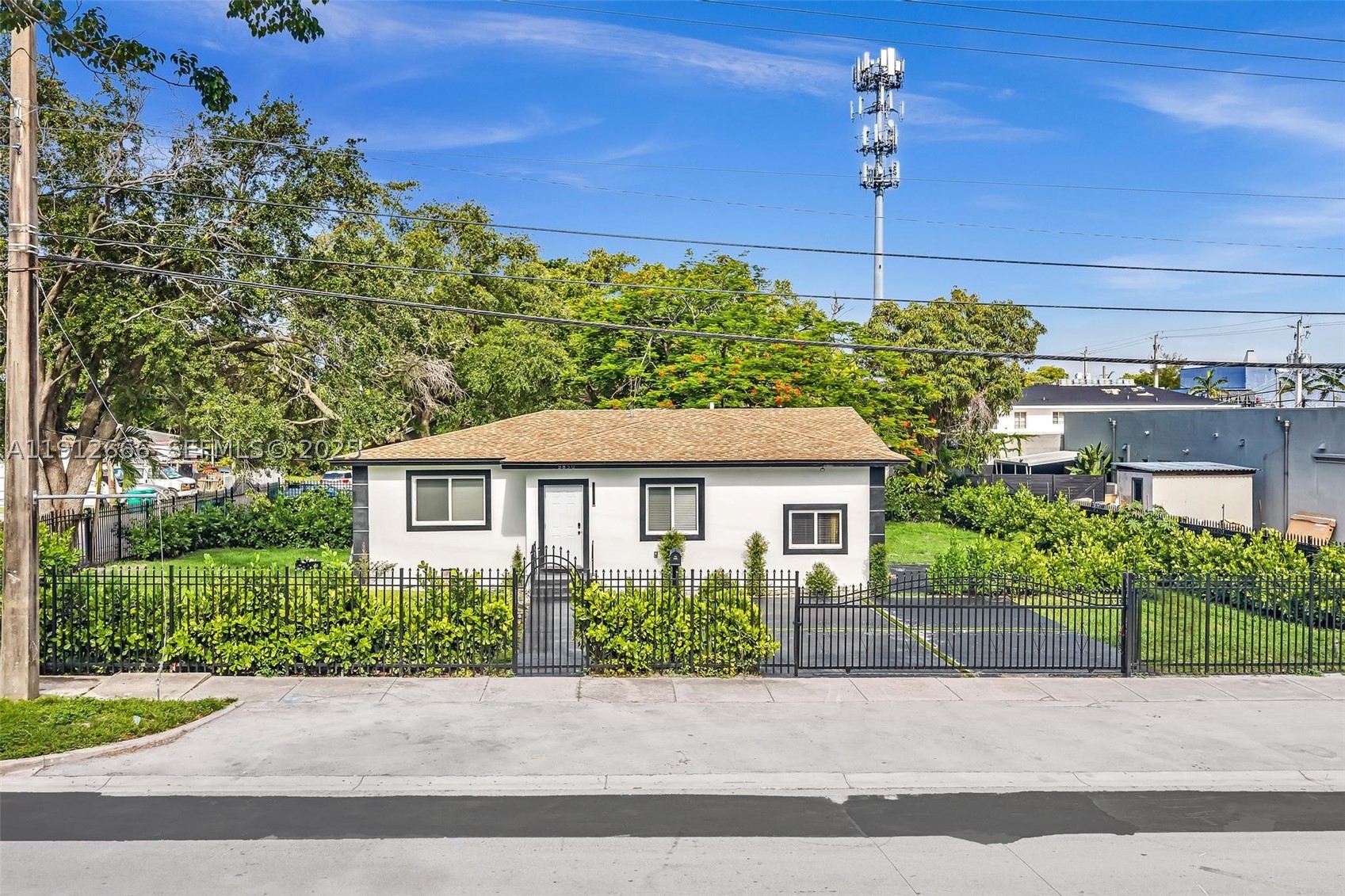 Stunning Fully Renovated 4-Bed, 3-Bath Home in Prime Miami Location. situated on an oversized corner lot, just one block from the Cultural Arts Center and the exciting new Magic City Innovation District, you’re only minutes from Miami Design District. This home features a new 2023 roof, new A/C units, and extensive electrical and plumbing upgrades throughout all three bathrooms, tankless water heater and recessed lighting throughout home. kitchen boasts brand-new cabinetry and premium stainless steel appliances, porcelain flooring, impact windows and doors. Step outside to a lushly landscaped yard enhanced with exterior lighting, mature trees, and privacy plants, for relaxation or hosting guests. property fully gated. This home offers the perfect blend of space, style, and location!
