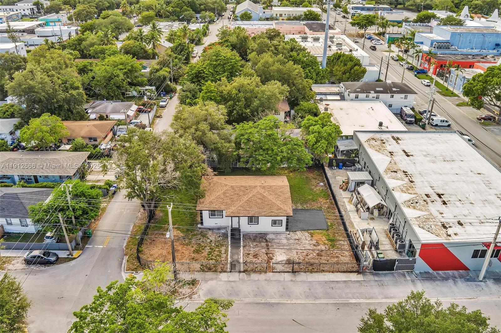 Stunning Fully Renovated 4-Bed, 3-Bath Home in Prime Miami Location. situated on an oversized corner lot, just one block from the Cultural Arts Center and the exciting new Magic City Innovation District, you’re only minutes from Miami Design District. This home features a new 2023 roof, new A/C units, and extensive electrical and plumbing upgrades throughout all three bathrooms, tankless water heater and recessed lighting throughout home. kitchen boasts brand-new cabinetry and premium stainless steel appliances, porcelain flooring, impact windows and doors. Step outside to a lushly landscaped yard enhanced with exterior lighting, mature trees, and privacy plants, for relaxation or hosting guests. property fully gated. This home offers the perfect blend of space, style, and location!