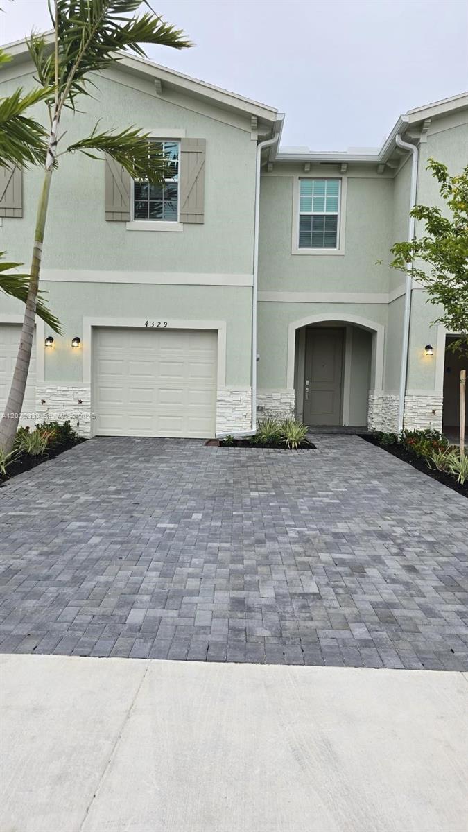 AVAILABLE FROM JULY 1, 2026. Discover your new home in the exclusive Lennar LAKESHORE AT THE FOUNTAINS community in LAKE WORTH! This new townhome features a spacious living room, a modern kitchen with an island and stainless steel appliances, and a half bath on the ground floor. Enjoy a large grassy patio and a covered garage. The second floor boasts three spacious carpeted bedrooms, and two full bathrooms. Ideally located near schools, shopping centers, and plazas. Don't miss this unique opportunity!