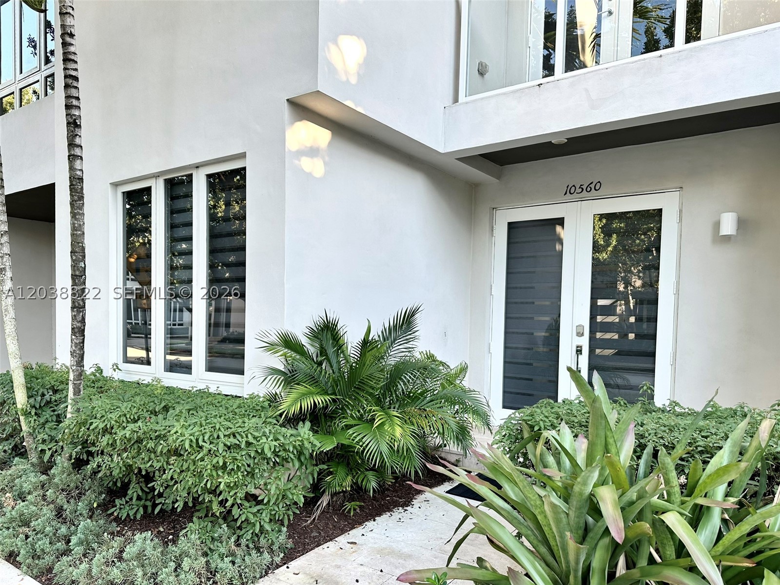 Stunning 3-story townhouse in the prestigious Landmark at Doral! This modern home features 1 bedroom and 1 full bathroom on the first floor, an open-concept layout, porcelain floors, impact windows and doors, stainless-steel handrails, and a gourmet kitchen with quartz countertops and stainless-steel appliances. Enjoy custom closet cabinetry, second-floor laundry, a private patio, 1-car garage, and a spacious driveway up to 2-3 cars. The rooftop terrace features a summer kitchen and a relaxation area, perfect for entertaining. Resort-style amenities include pools, spa, fitness center, tennis courts, sauna and more. Prime Doral location near A-rated schools, shopping, dining, Miami International Airport, and major highways, including the Turnpike, Palmetto, and Dolphin Expressways.