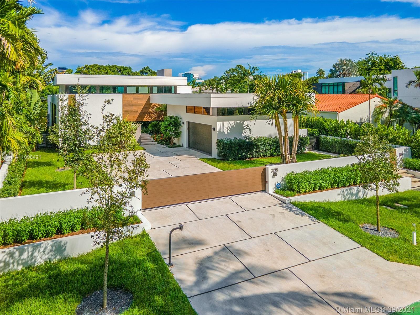 Modern Architectural Masterpiece designed by Praxis Architecture + Design & built by Prieto Development in 2021. This stunning luxury home sits on oversized 14,100 SF lot steps from Miami Beach Golf Club. One story home w/a total of 5,180 SF of seamless indoor/outdoor living space. Open floor plan perfectly designed for entertaining, 10 & 15 foot ceilings & plenty of natural light make this 4 bed, 5.5 bath home one of a kind. Italian Design Kitchen w/ top of the line appliances. Large main Bedroom w/ two walk-in closets & elegant main bathroom with double shower. Outdoor terrace w/ beautiful swimming pool, summer kitchen and lush vegetation. Double car garage, and smart-home technology set up. BONUS: Home built to add a 2nd story w/additional 1,800 SF of living space.
