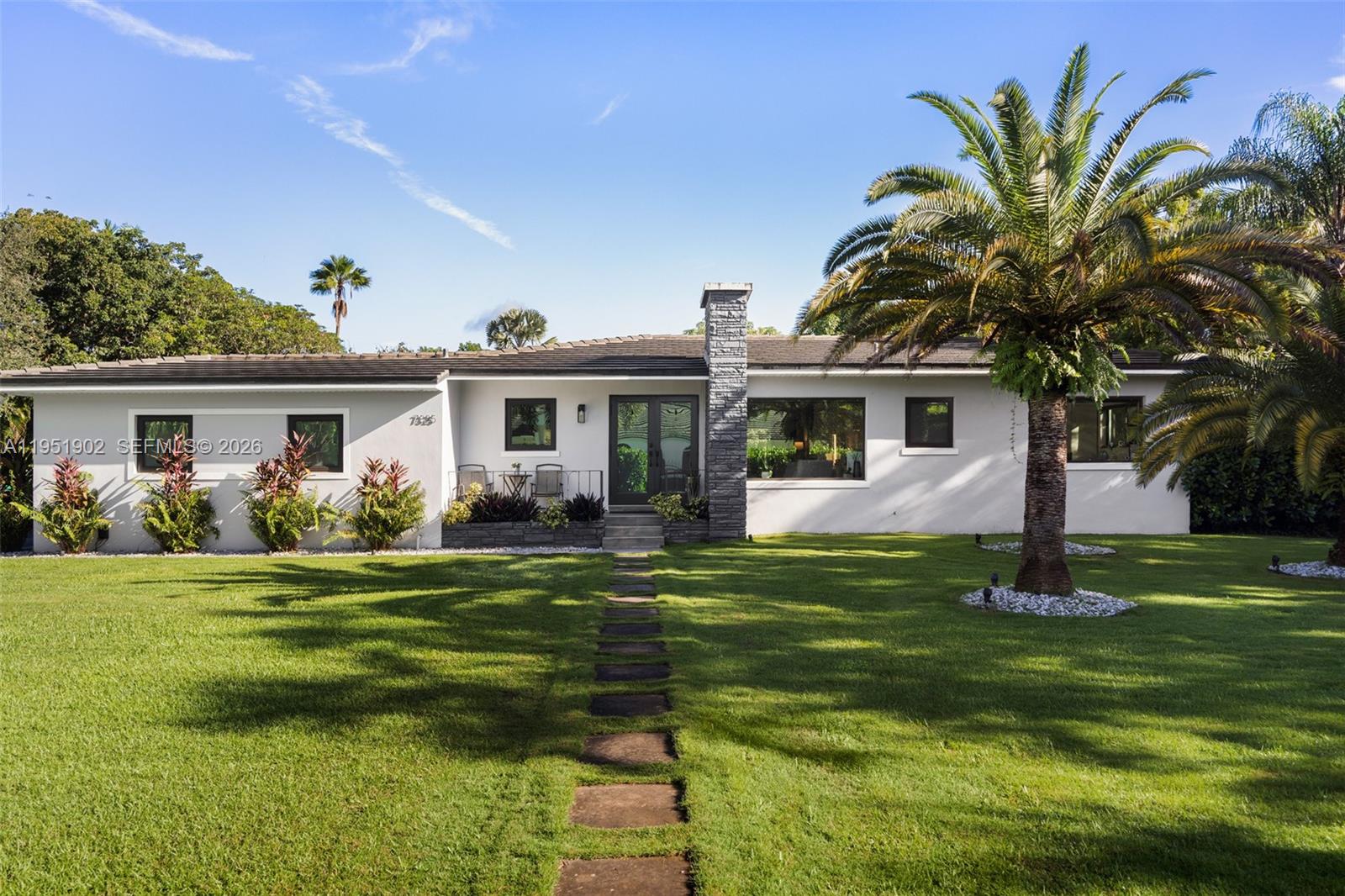Set on over an acre in prestigious North Pinecrest, this exceptional property offers an increasingly rare opportunity to secure a park-like estate in one of the area’s most desirable and established residential neighborhoods, known for its estate properties, privacy, and top-tier schools. The grounds feature mature tropical landscaping, select fruit trees, and expansive open lawns, creating a serene setting and an exceptional sense of space, making it an ideal canvas for a future custom estate.

Zoning allows for a secondary structure, enabling the addition of a guest house, home office, or other complementary use in support of the main residence. Existing infrastructure, including a natural gas connection, a full-house gas generator capable of supporting a larger residence, and an already-installed municipal water connection, adds meaningful value for future planning.

The existing residence is light-filled and functional, offering flexibility while a future owner thoughtfully develops architectural plans and secures the necessary permits. Located within the highly sought-after Pinecrest school district, the property also benefits from convenient access to Dadeland-area amenities, Miami International Airport, and key commuter routes, combining a peaceful residential setting with easy everyday accessibility.