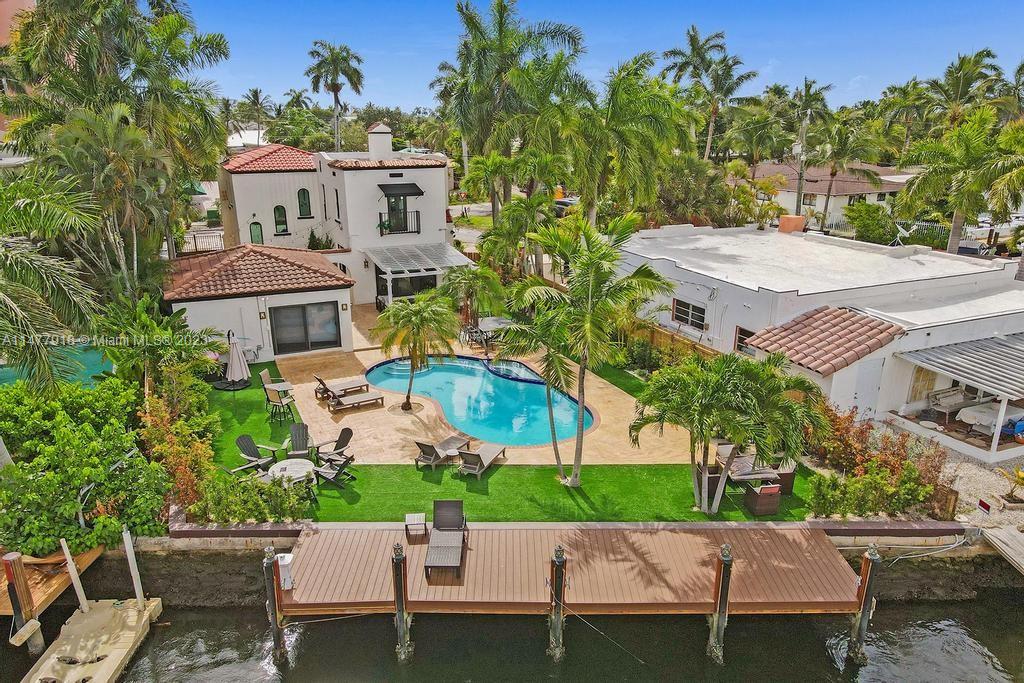 This historical Florida waterfront gem located in east Fort Lauderdale's prestigious Isle Of Capri is now ready for it's new owners. The spacious 3,390 square foot living area has been beautifully renovated on the interior & exterior. It has consists of 5 bedrooms 3.5 bath in the main house, & a separate guest cottage with 2/1. Full impact windows & doors protect the home from wind, large master suit with en suite bathroom, beautiful wood work throughout the home, large living room, den, formal dining room & a true chefs kitchen. The fully updated guest cottage by the pool welcomes your guests! Located in a walking distance to all Las Olas restaurants, shops, & beautiful Fort Lauderdale beach this boaters paradise is ready to entertain! Furniture NOT included, but can be added.